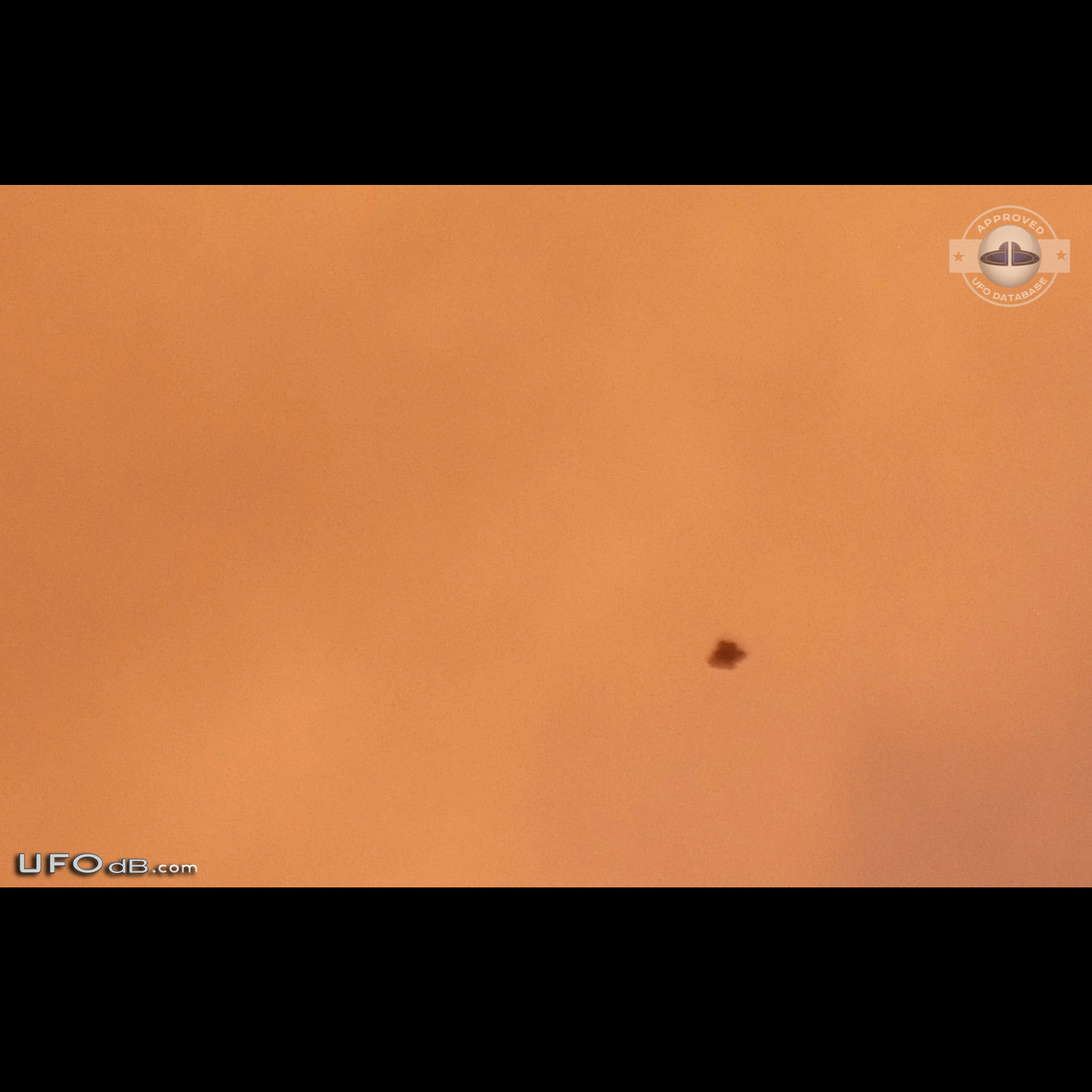 3 witness saw a black bell UFO disappearing in clouds - Australia 2013 UFO Picture #551-1