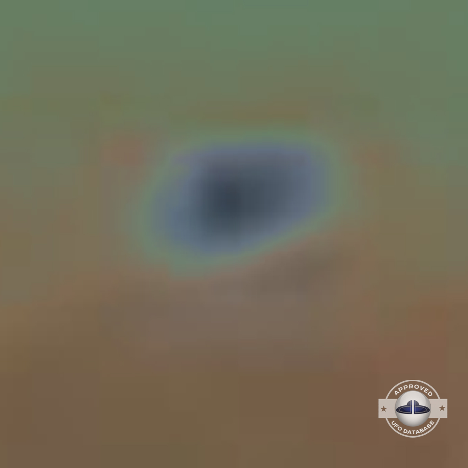 While taking a picture of 2 persons near lake Titicaca, capture a UFO UFO Picture #82-6