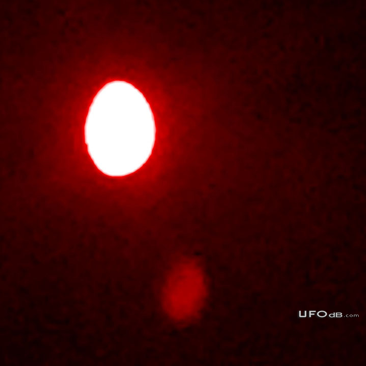 Bright UFO appearing to have wings but changed viewed with binoculars  UFO Picture #815-2