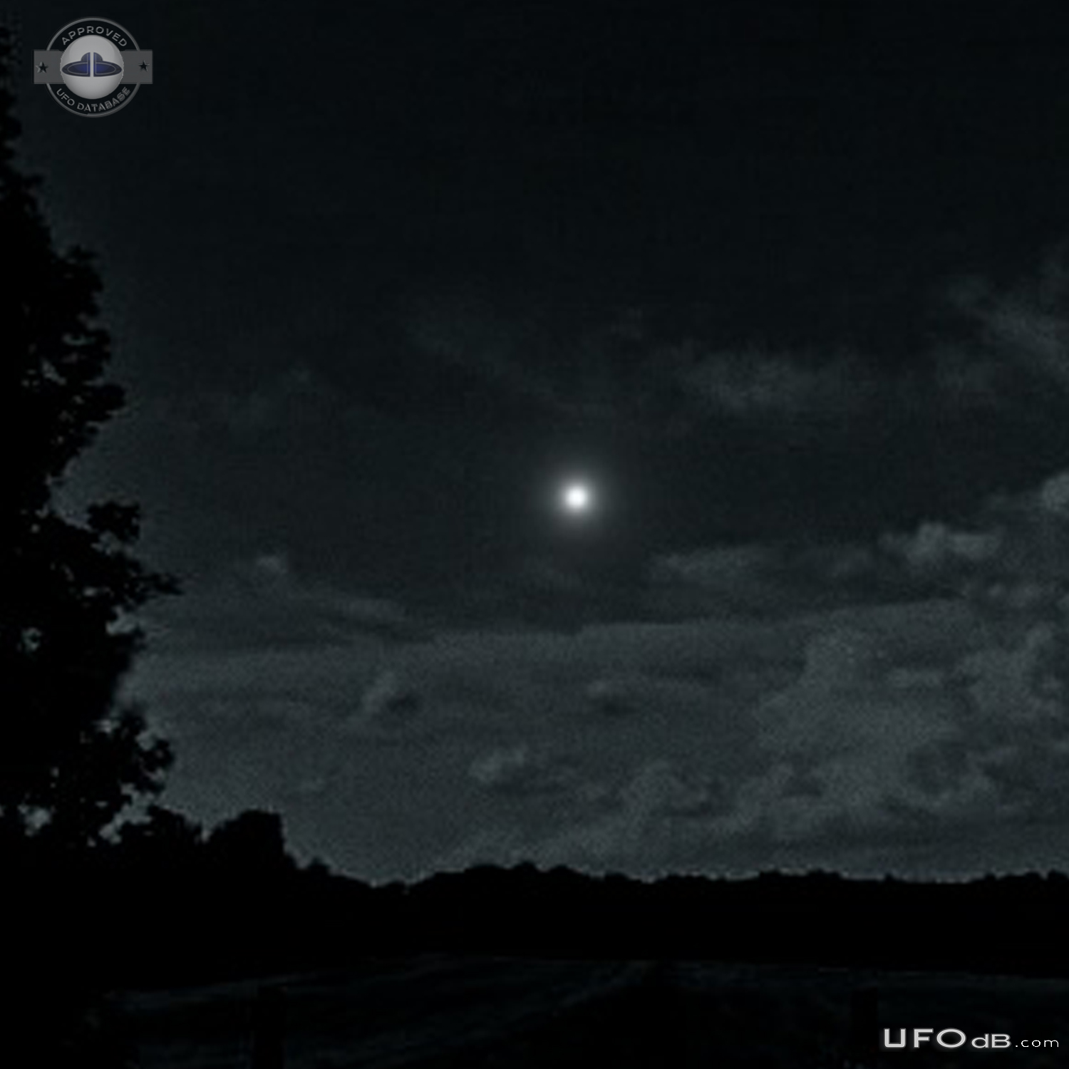 Bright white light UFO hovered continued on path then quickly faded ou UFO Picture #796-2