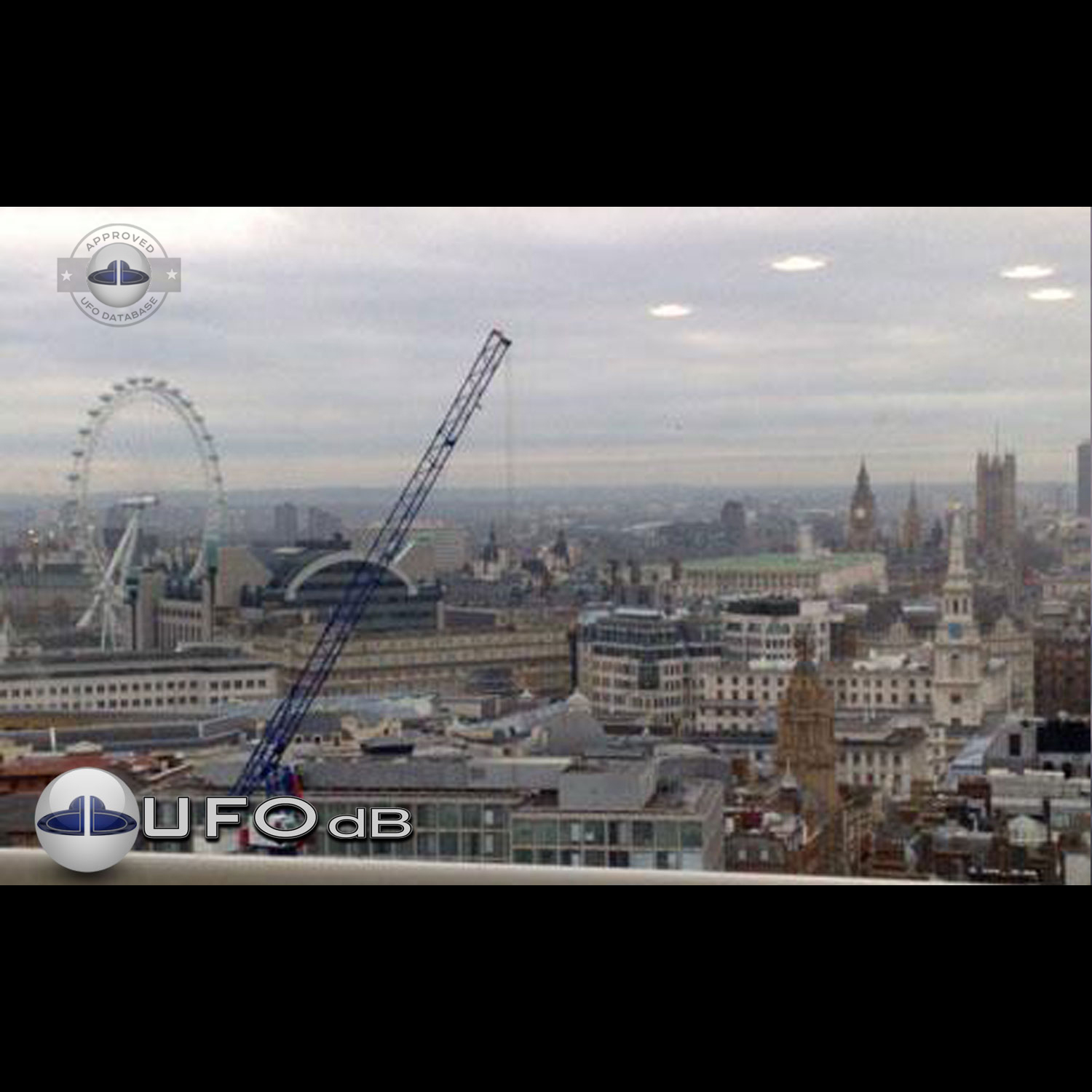 UFO picture we can see 4 white rounds coming out of the grey clouds UFO Picture #60-1