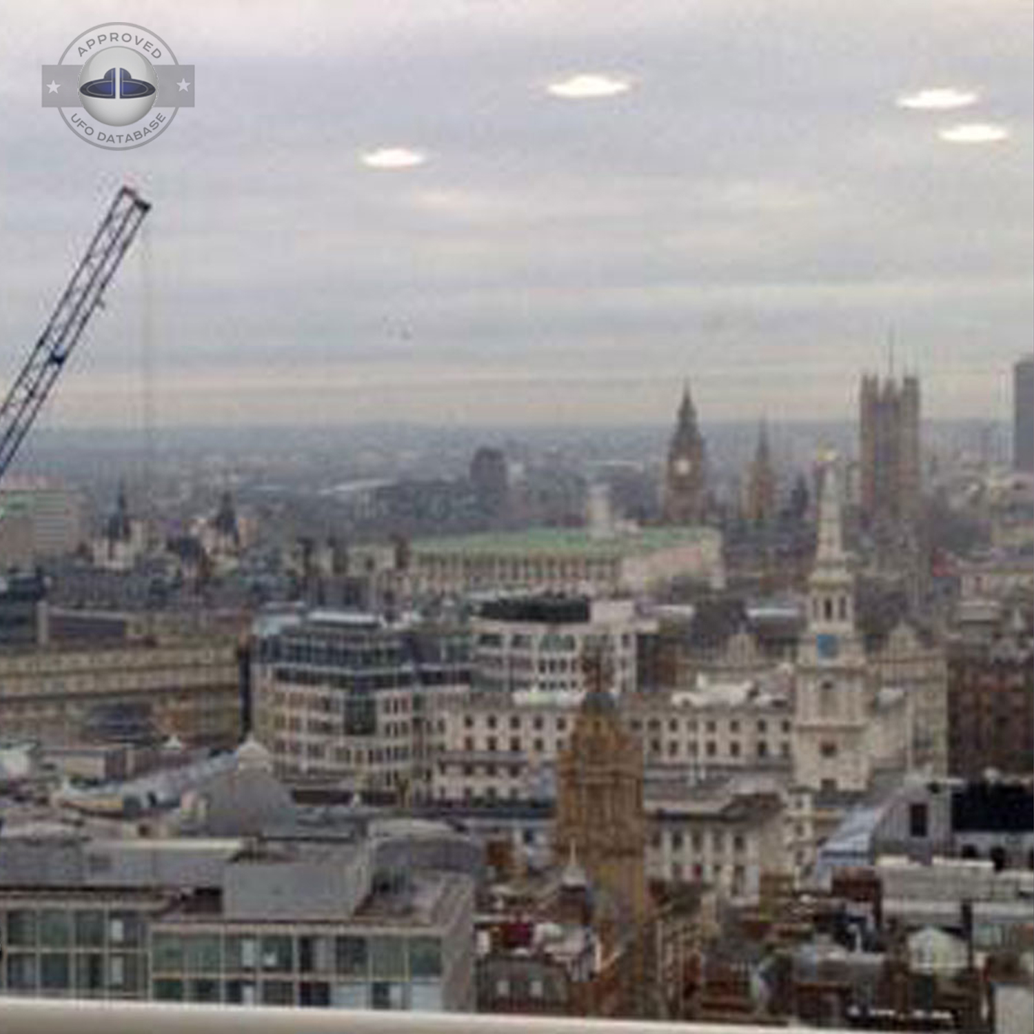 UFO picture we can see 4 white rounds coming out of the grey clouds UFO Picture #60-2