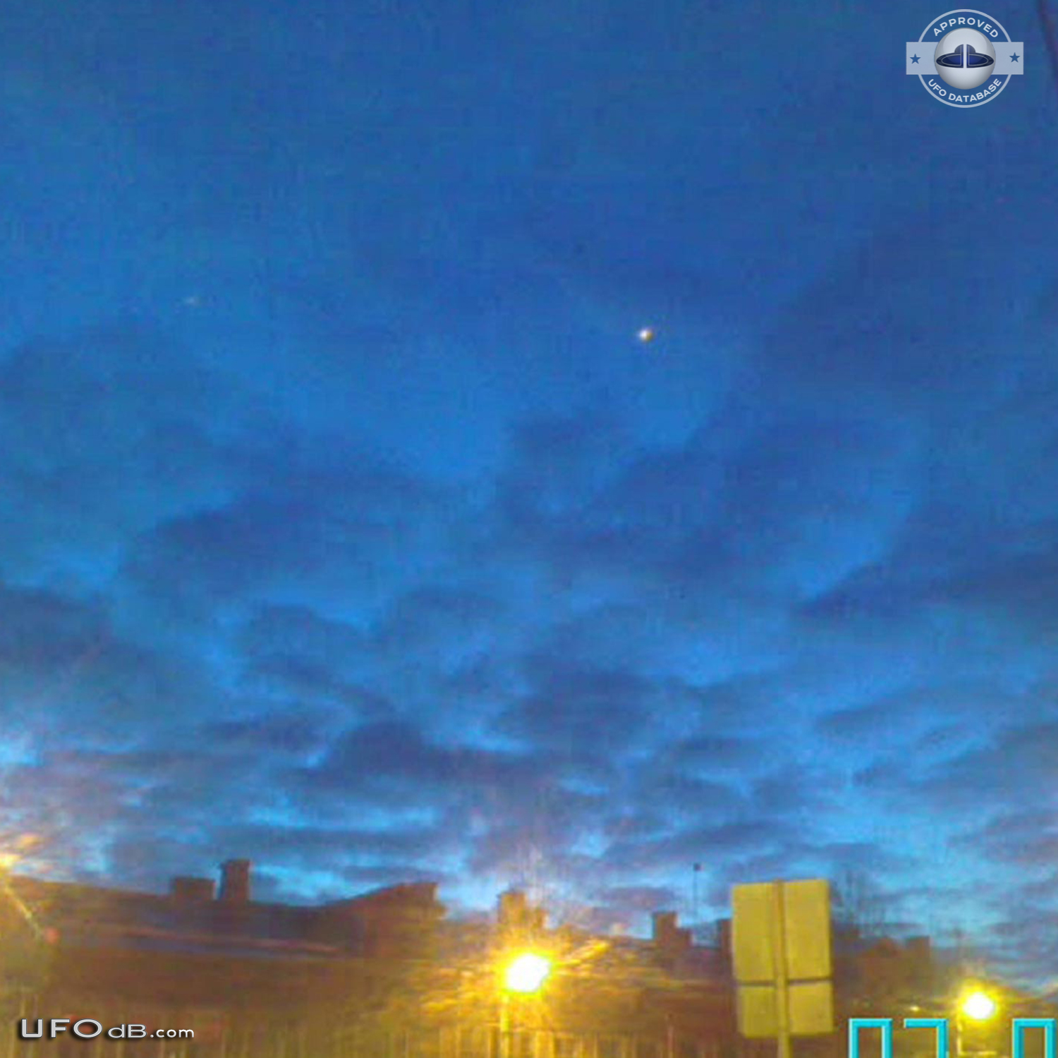 Fleet of 7 ufos changing color caught on photo over Riga, Latvia 2010 UFO Picture #405-2