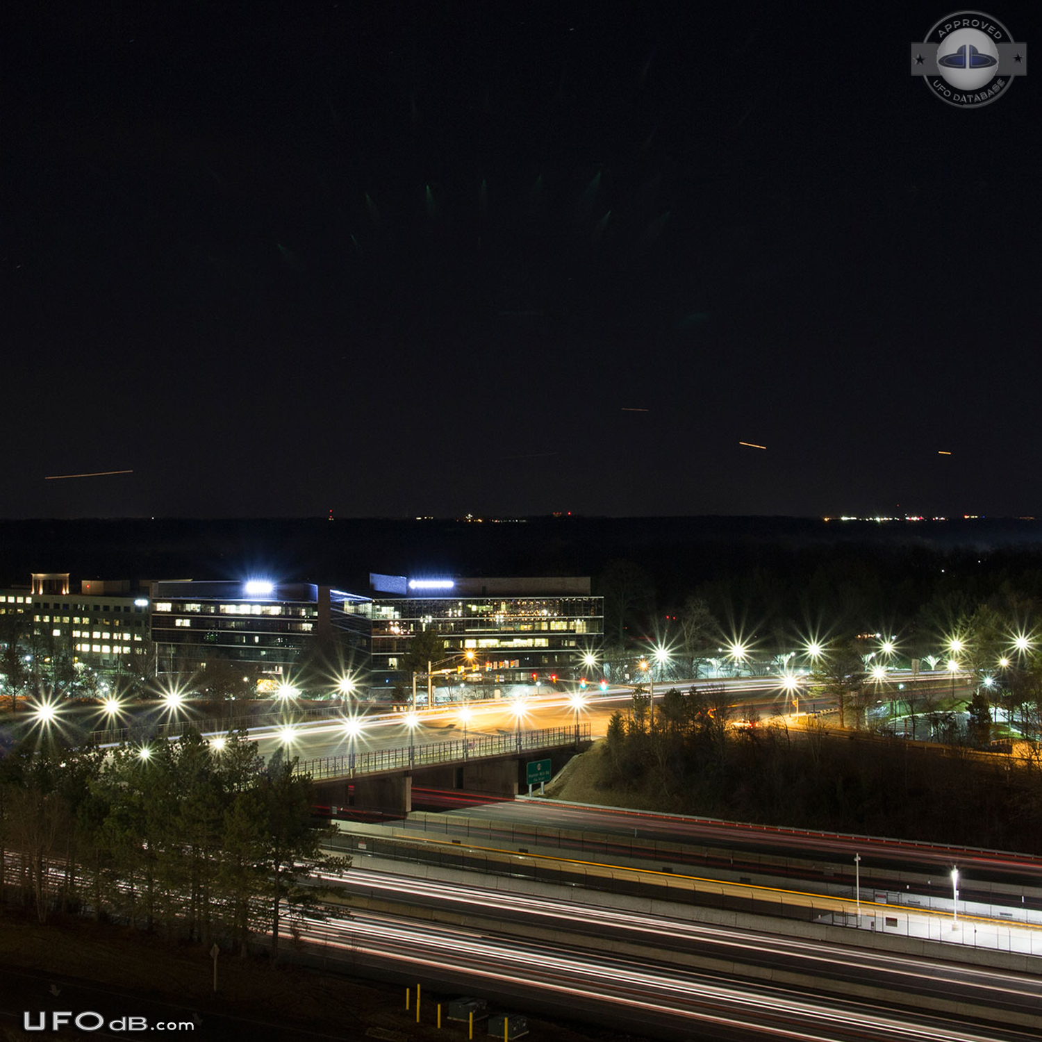 Green lights in formation, possibly emitted by circular objects UFO Picture #580-1