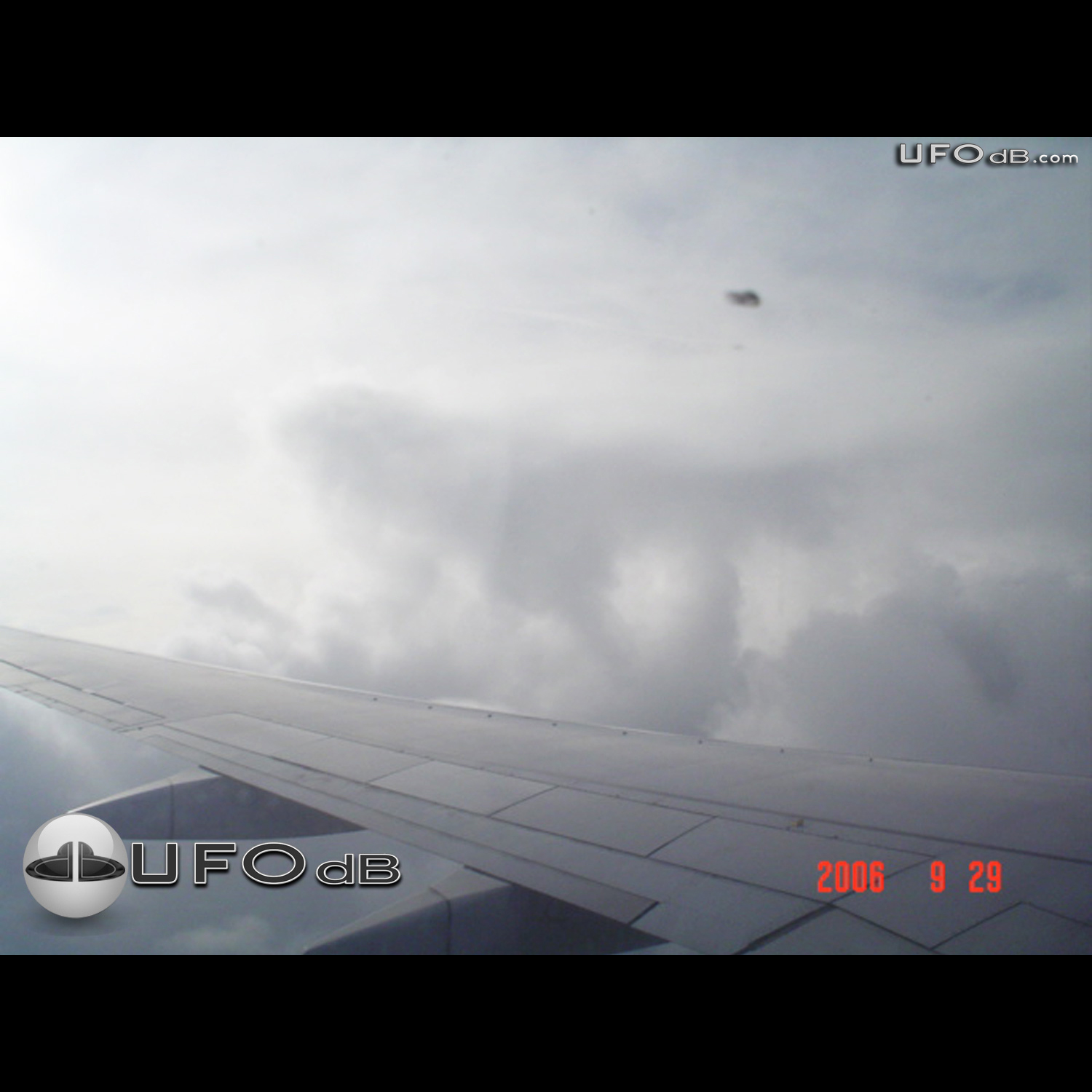 KLM Airplane passenger see UFO near wing | Amsterdam, Netherlands 2006 UFO Picture #255-1