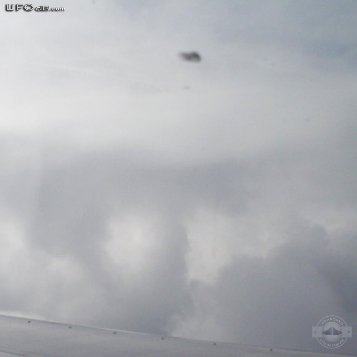 KLM Airplane passenger see UFO near wing | Amsterdam, Netherlands 2006 UFO Picture #255-3