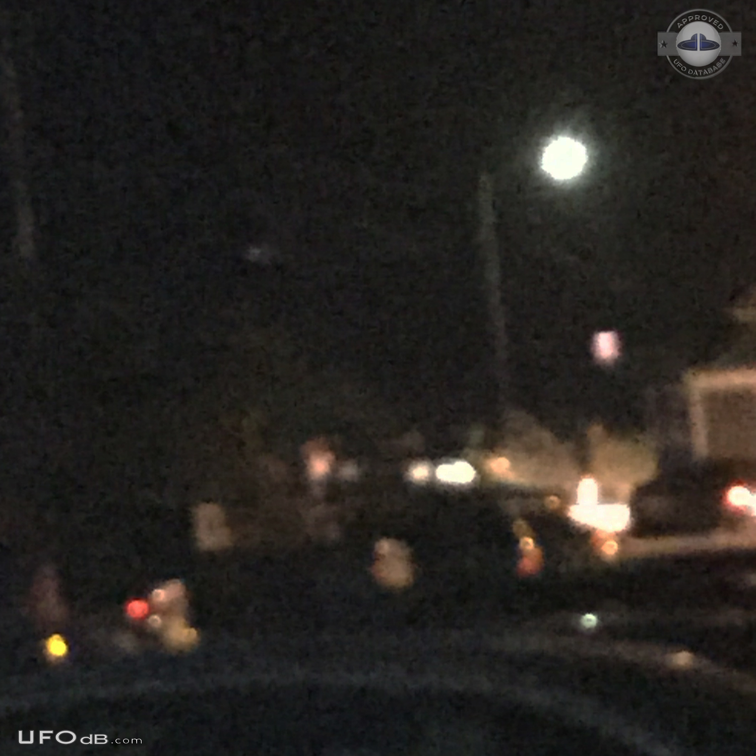 Looked like mothership with smaller glowing craft flying around it in  UFO Picture #708-2