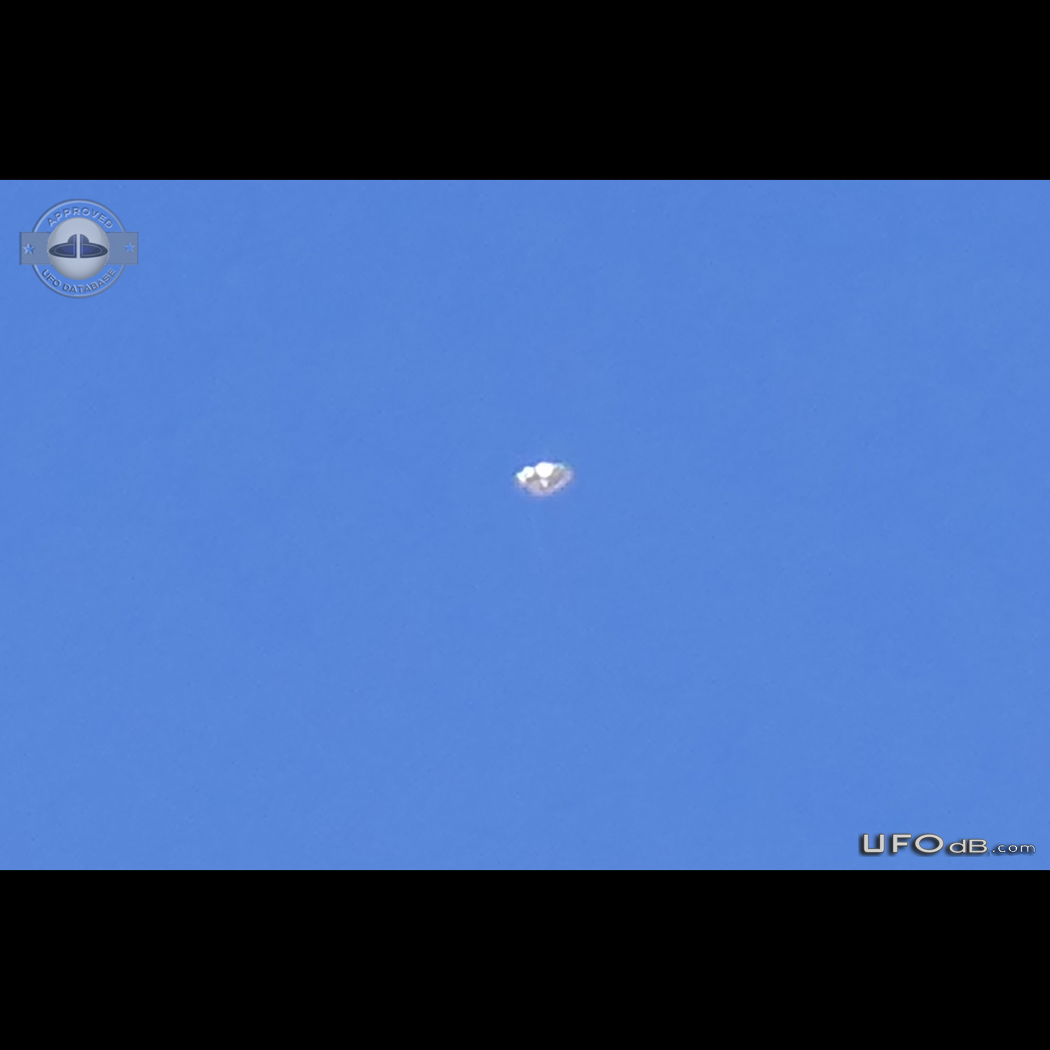 Looked up at a high altitude jet stream, saw a glint UFO shinning Ariz UFO Picture #809-1