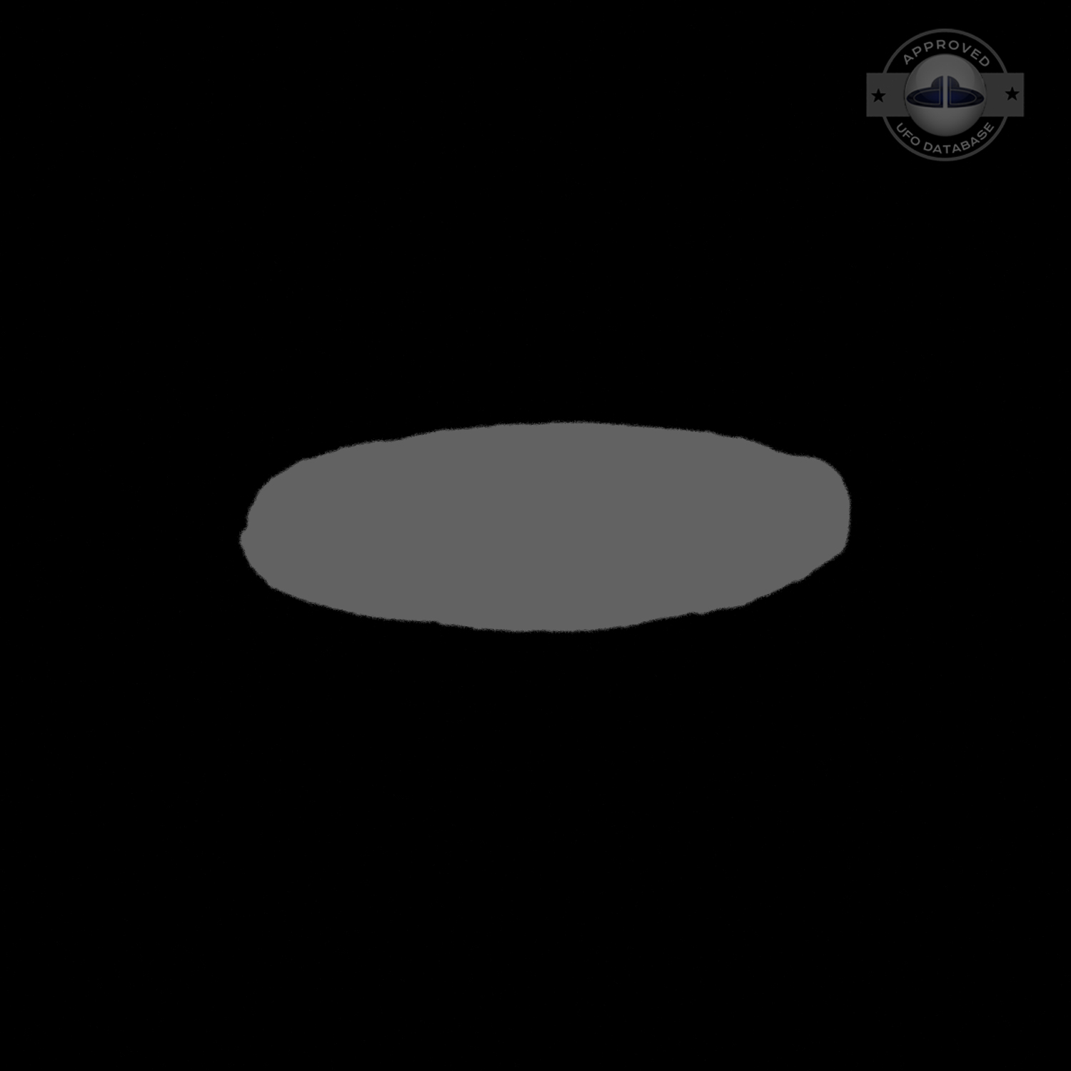 UFO picture showing a bright flat round disc passing near a building UFO Picture #54-8