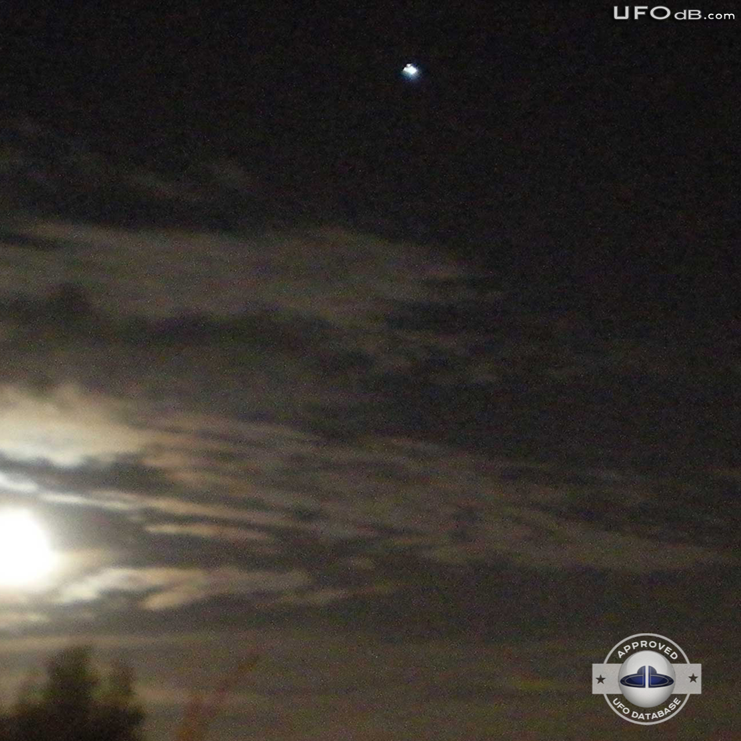 Moon picture captures bright white glowing UFO over a city in Ecuador UFO Picture #352-2
