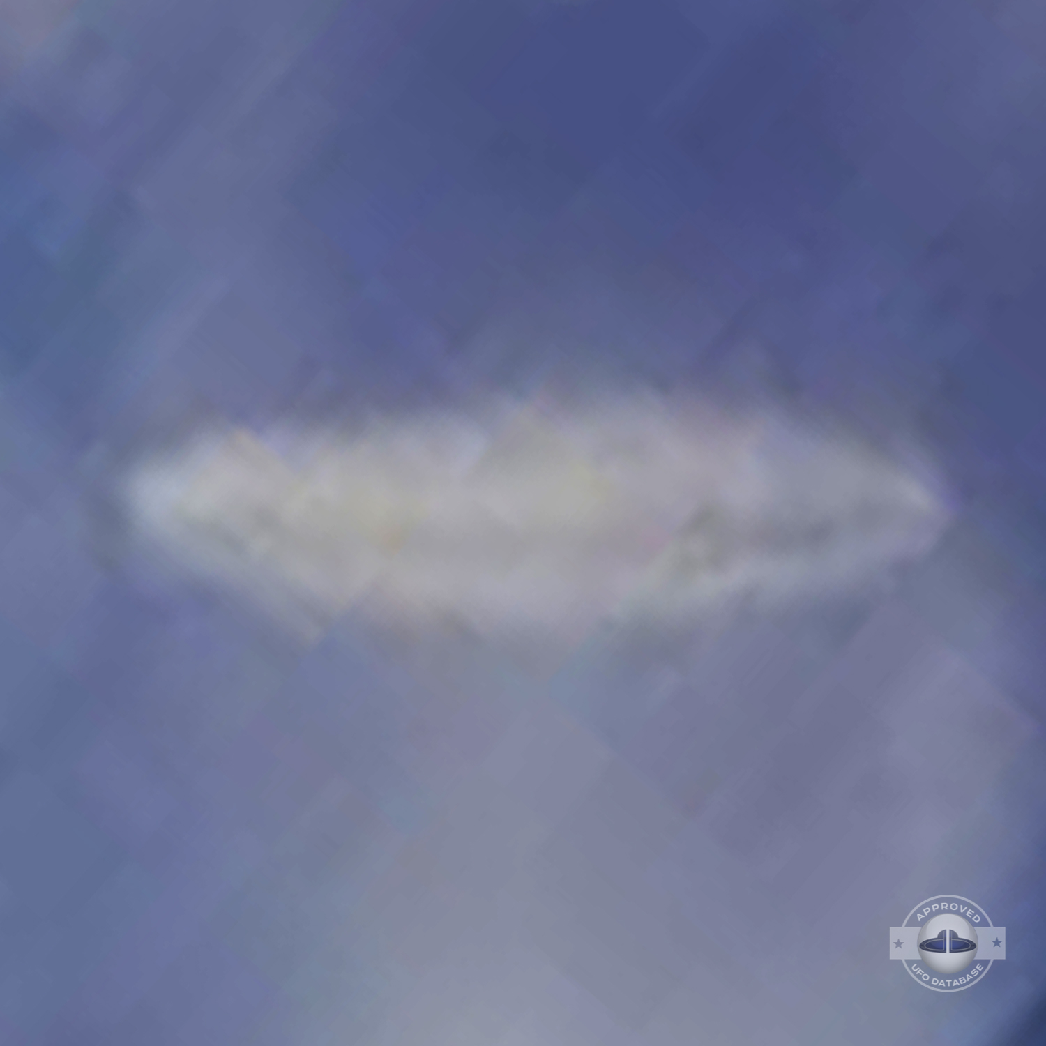 UFO almost sideways over buildings leaving a white gaseous trail 1957 UFO Picture #124-6