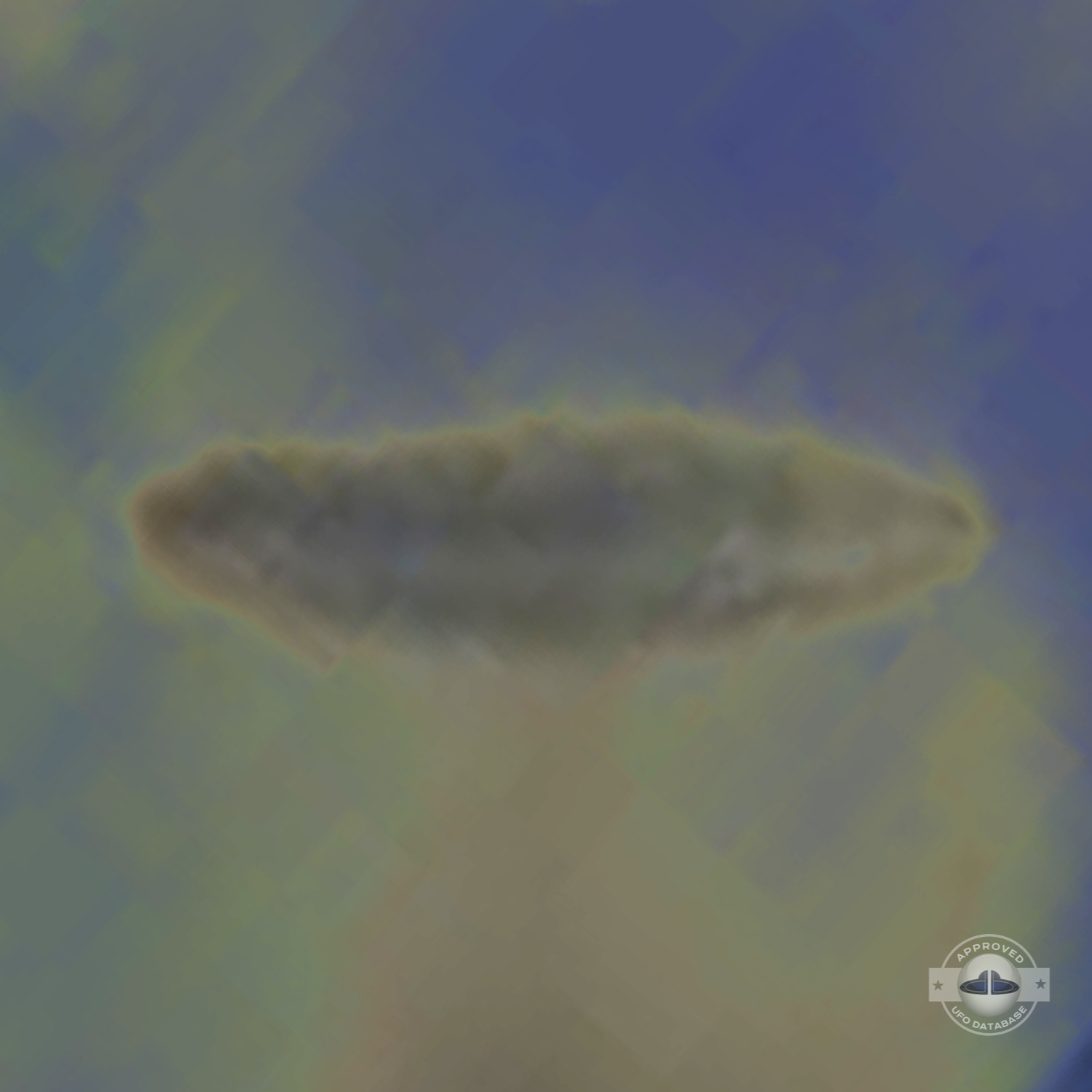 UFO almost sideways over buildings leaving a white gaseous trail 1957 UFO Picture #124-7