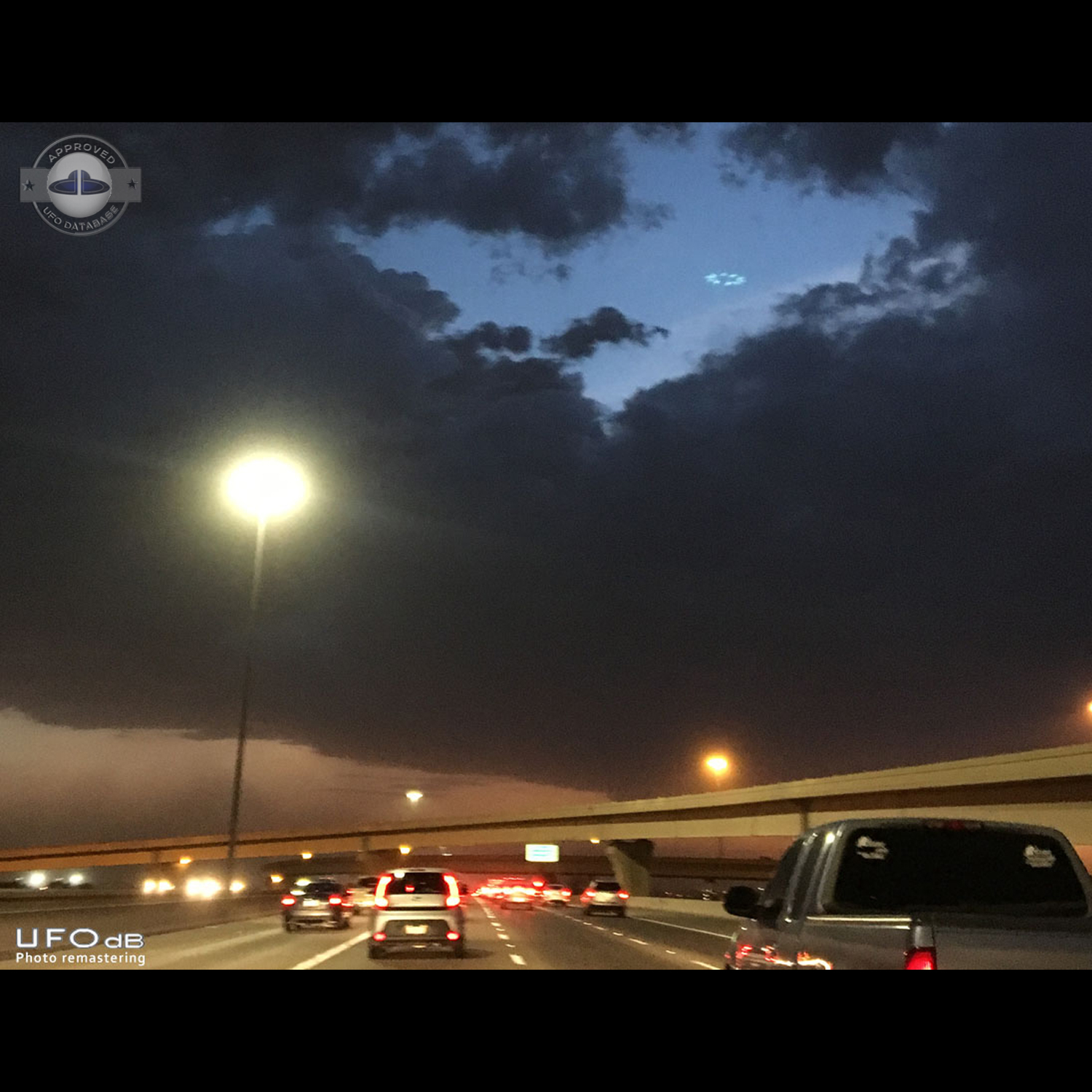 Photo during storm get saucer UFO in cloud hole Phoenix Arizona USA 20 UFO Picture #814-1