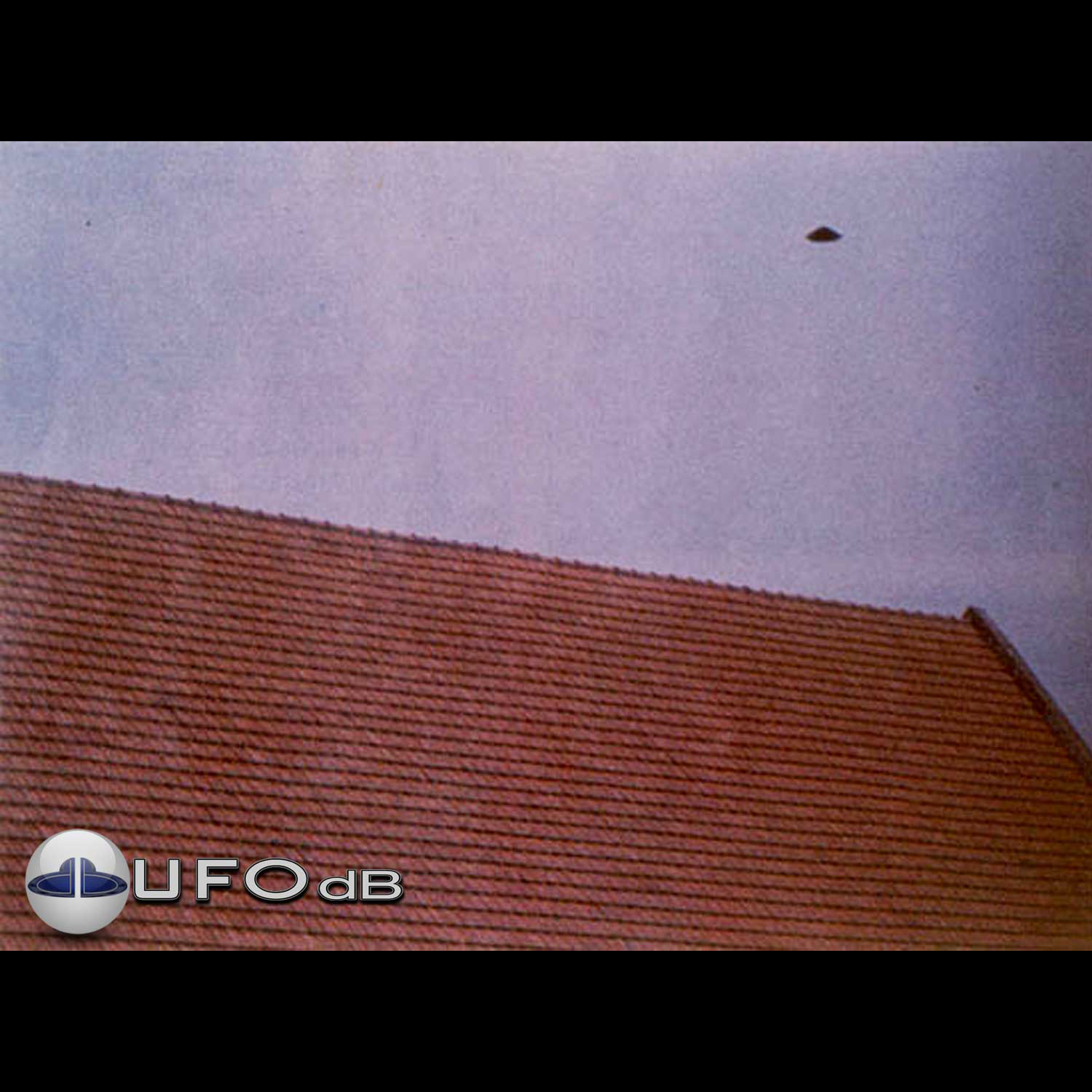 UFO seen over a roof of a house in Puerto Madryn in Argentina 1975 UFO Picture #28-1