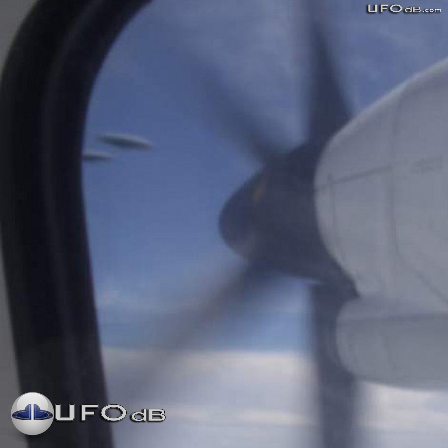 Random picture taken from airplane over Germany captures 3 saucer UFOs UFO Picture #362-1
