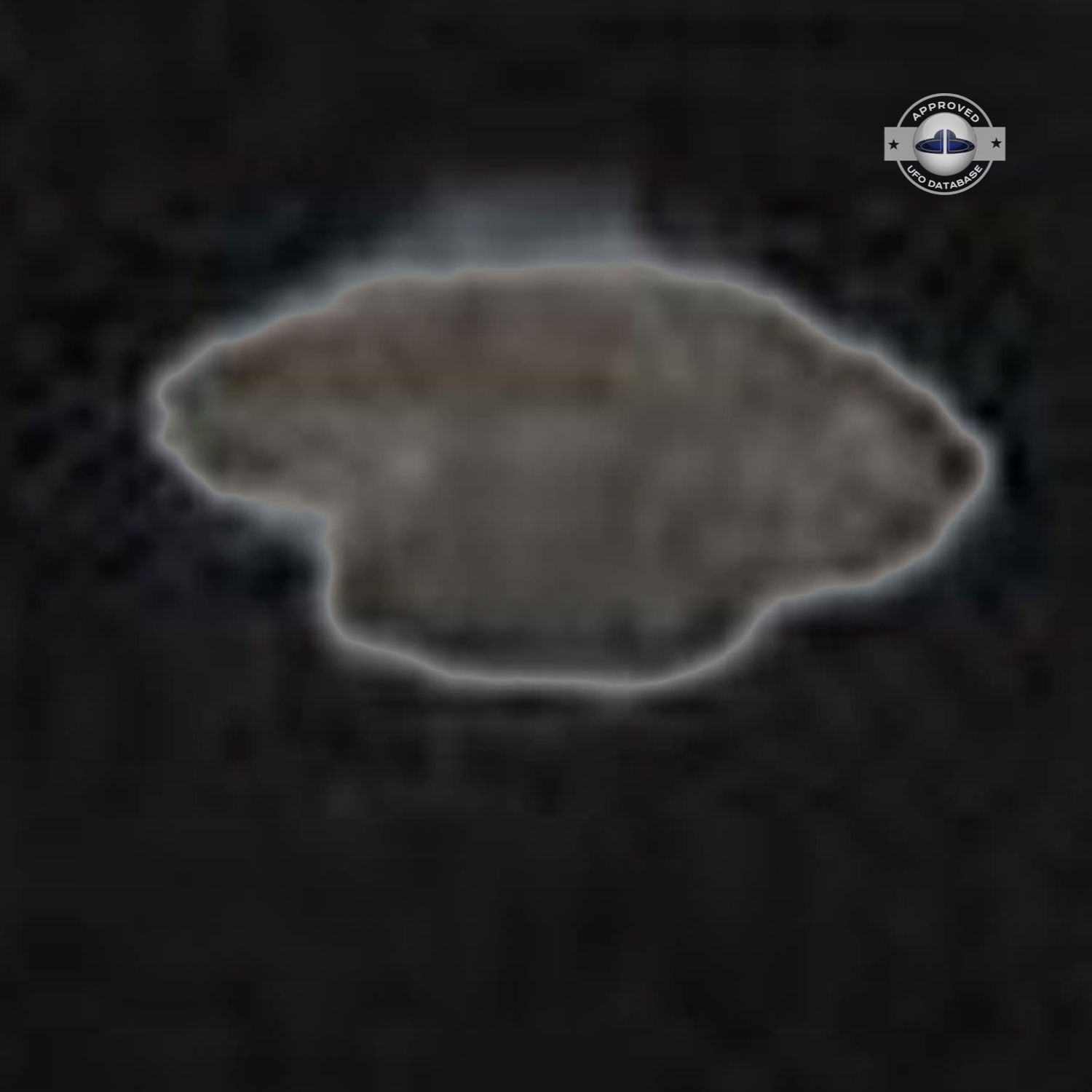 UFO muffin shape flying saucer standing over electrical stucture UFO Picture #46-8