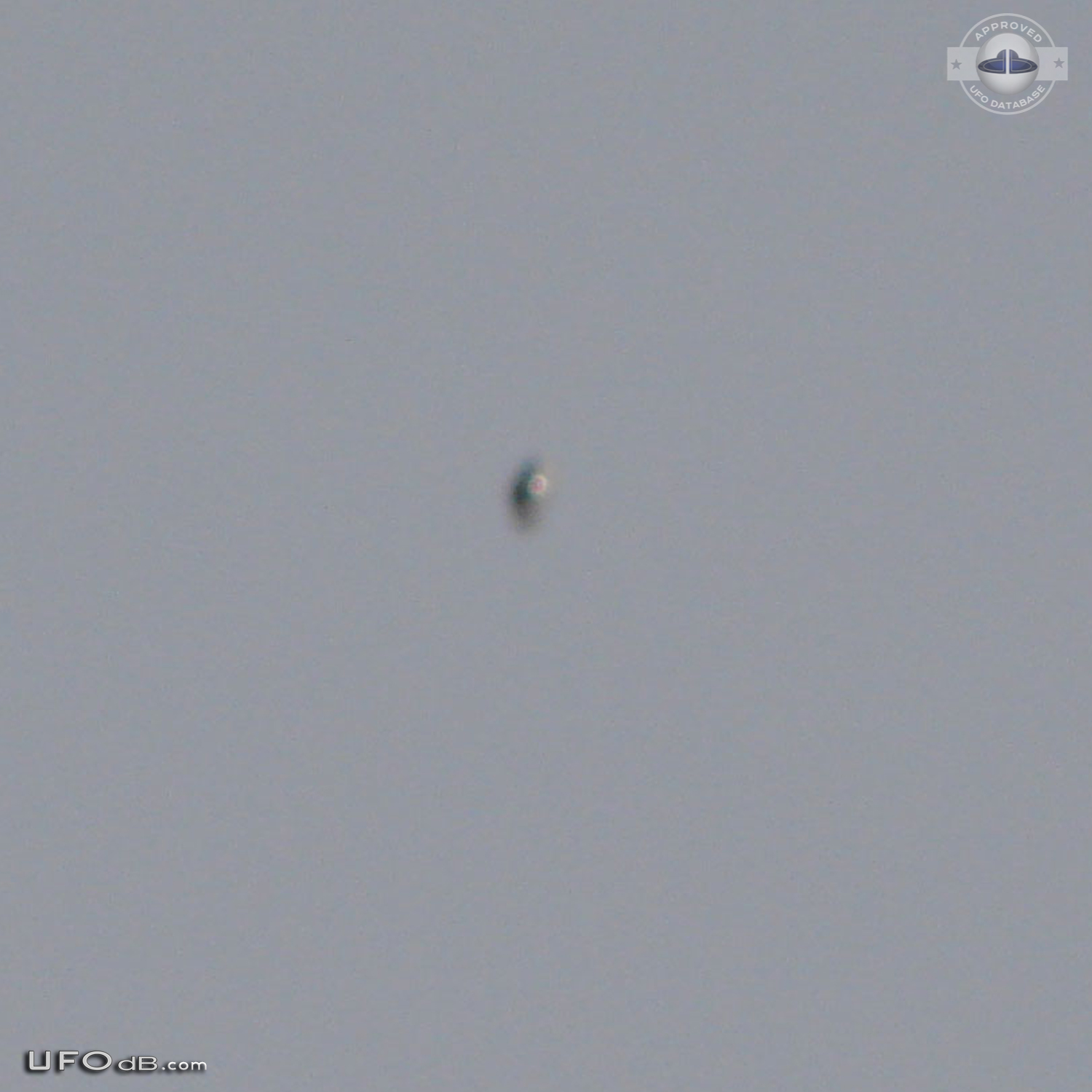 Shiny Upside-down Teardrop UFO rotating in the sky San Marcos CA USA UFO Picture #623-2