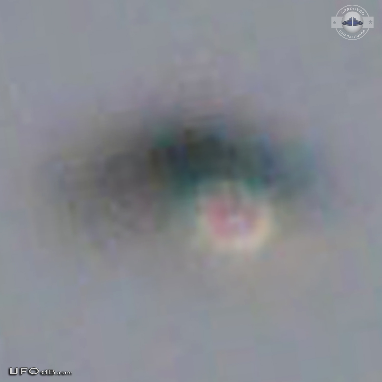 Shiny Upside-down Teardrop UFO rotating in the sky San Marcos CA USA UFO Picture #623-5