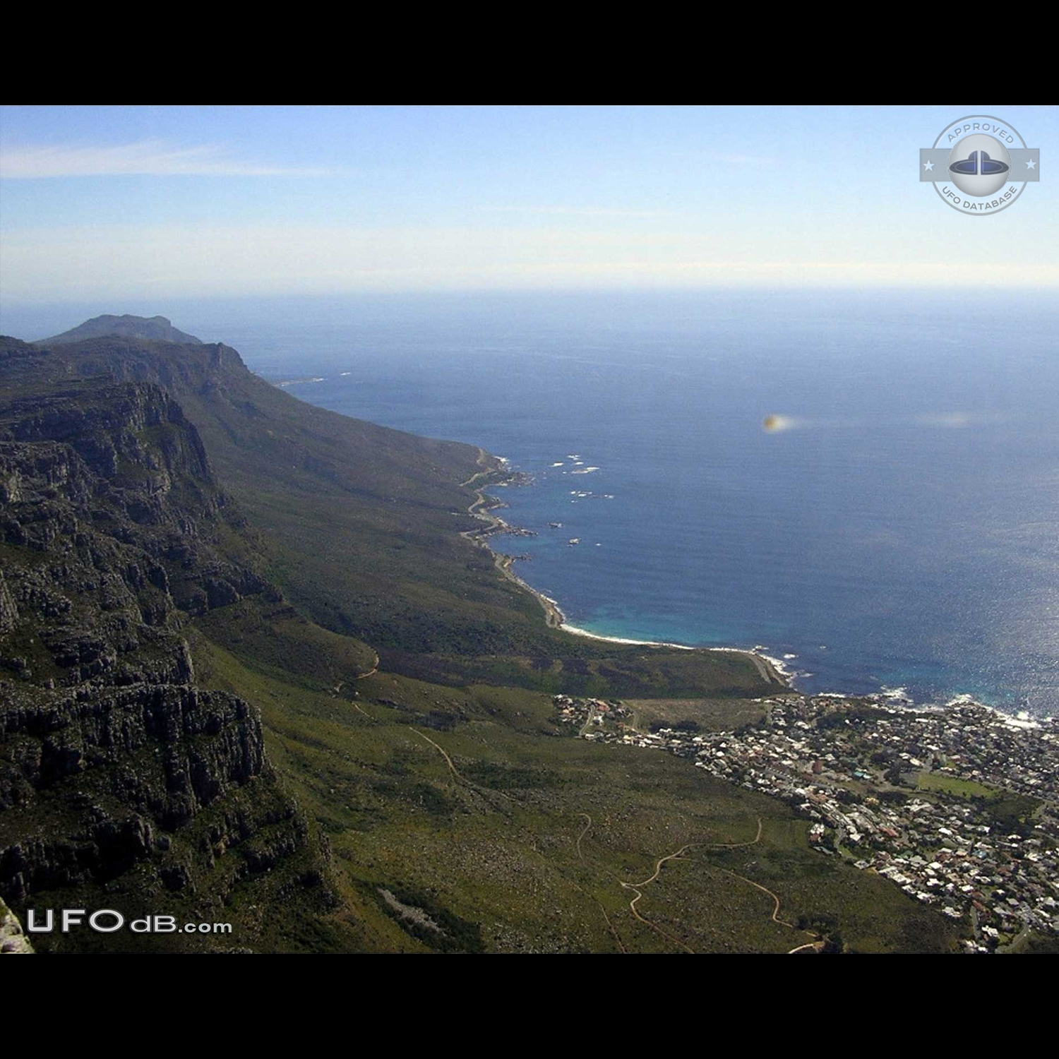 Sphere UFO with smoking tail seen near Table mountain, Cape Town 2004 UFO Picture #456-1