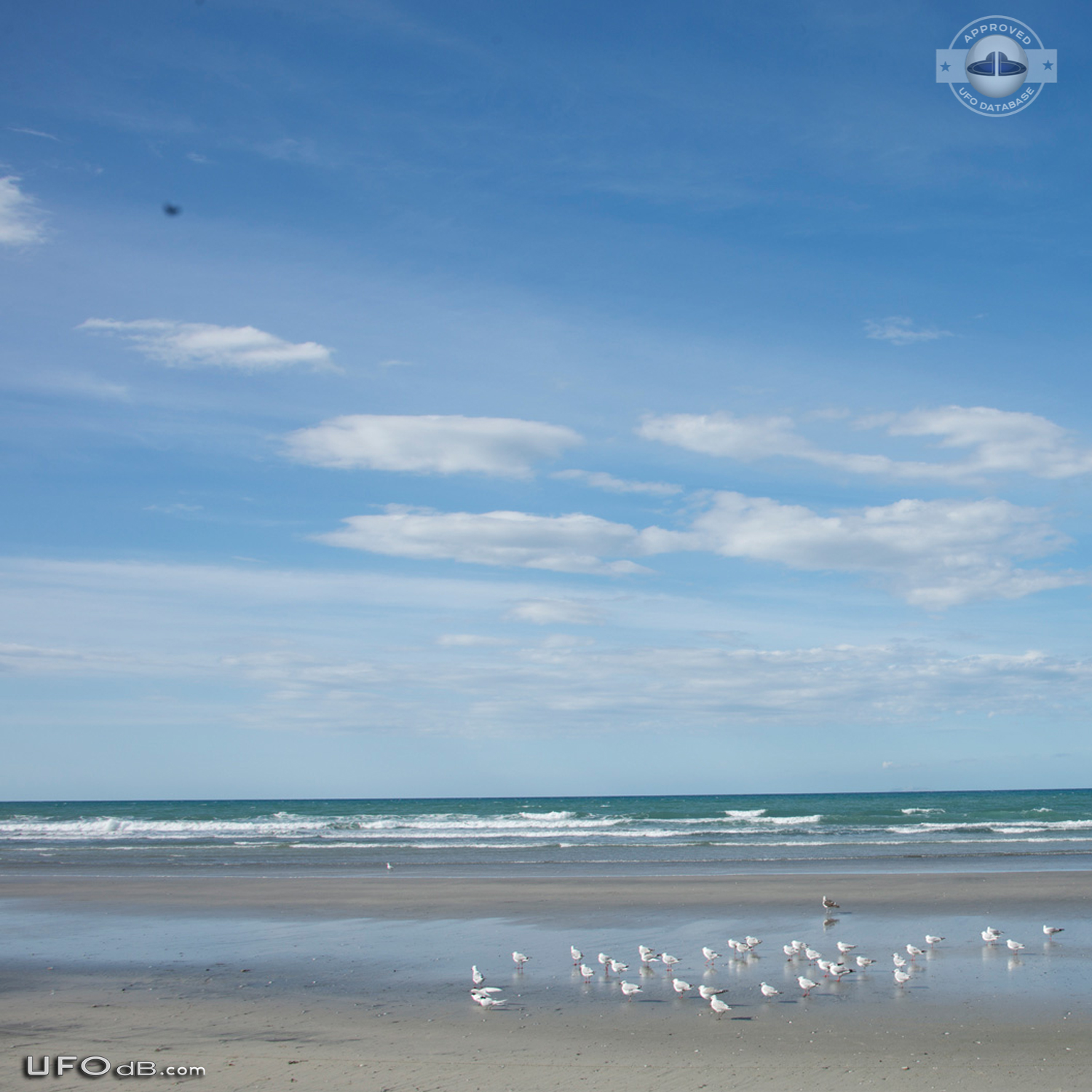Stationary dark UFO over ohope beach near Whakatane NZ 2015 UFO Picture #600-1