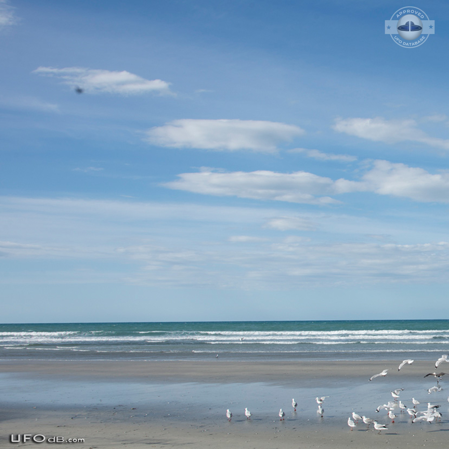 Stationary dark UFO over ohope beach near Whakatane NZ 2015 UFO Picture #600-4