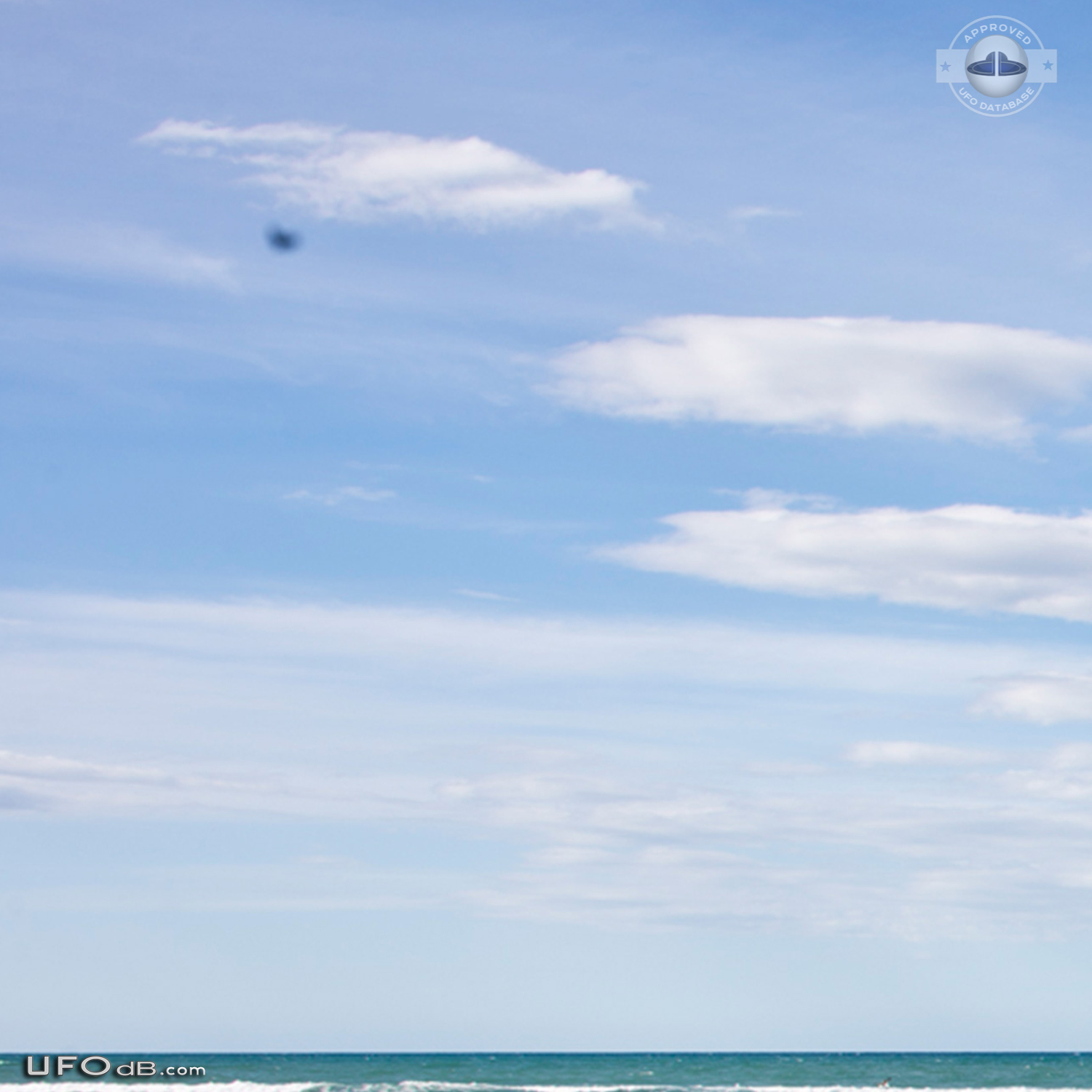 Stationary dark UFO over ohope beach near Whakatane NZ 2015 UFO Picture #600-5
