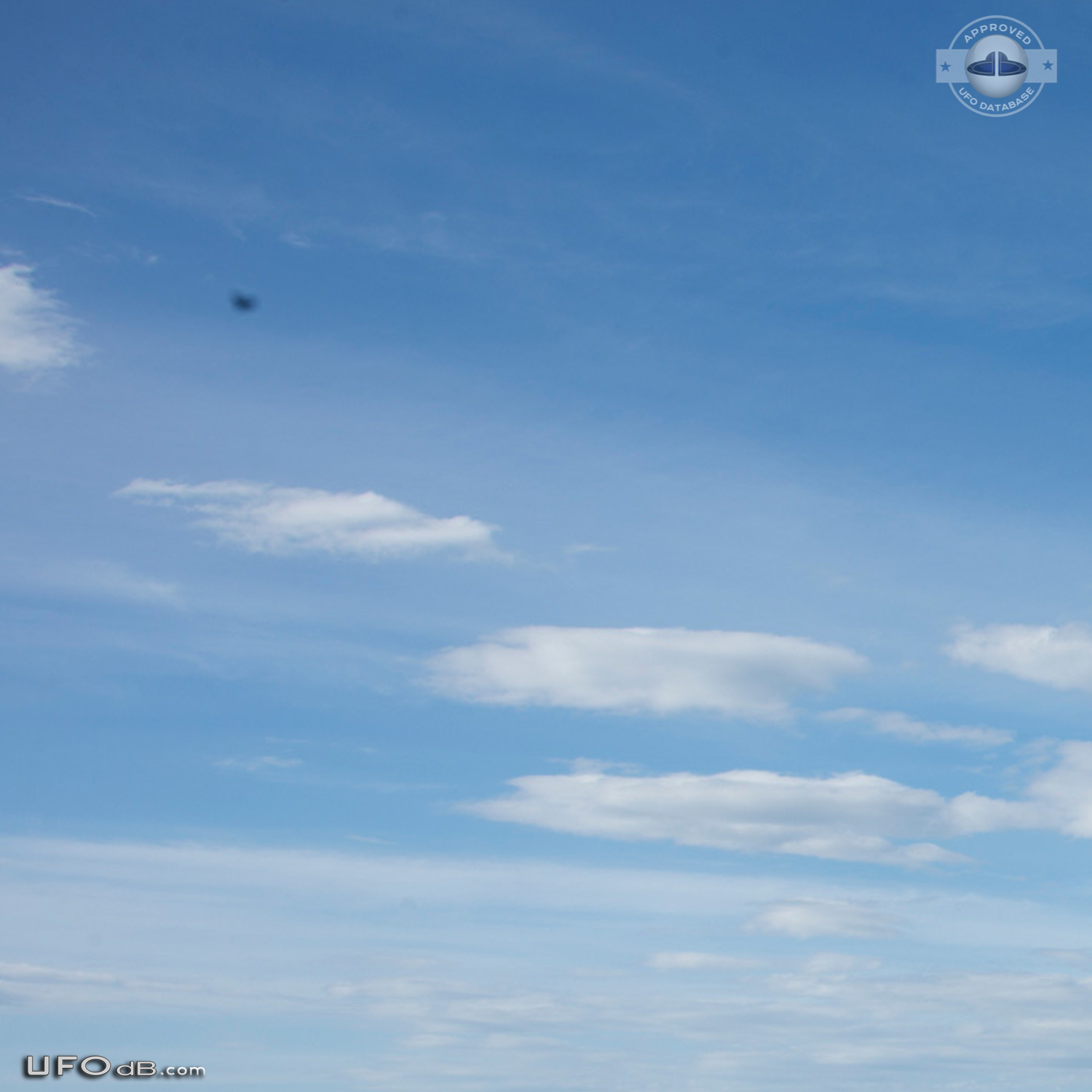 Stationary dark UFO over ohope beach near Whakatane NZ 2015 UFO Picture #600-6