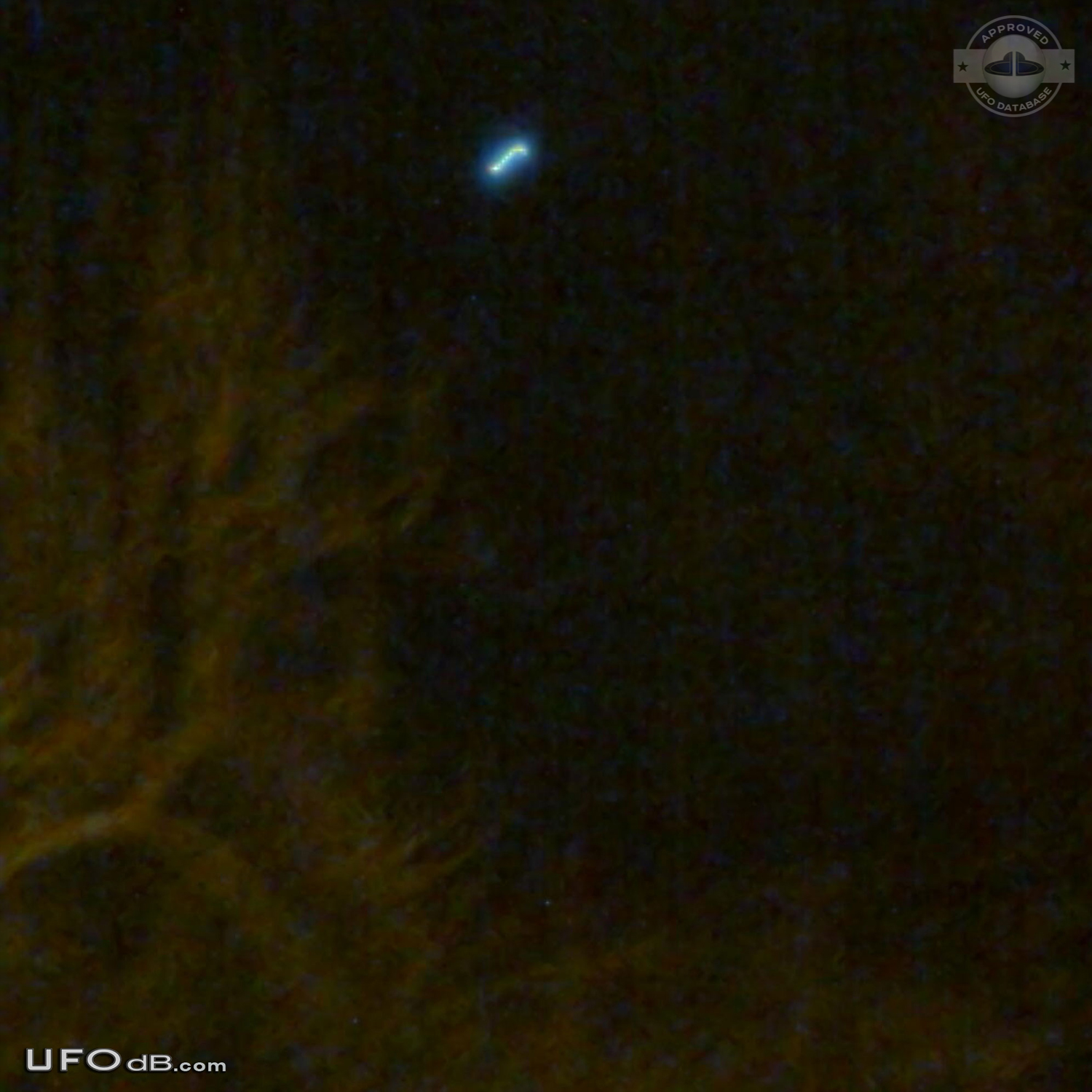 Student get a UFO on picture with cellular over Satu-Mare Romania 2010 UFO Picture #454-1