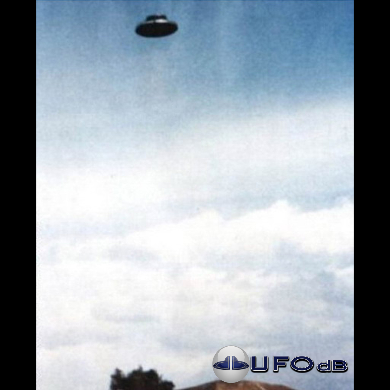 UFO picture - UFO in clear blue sky over one of the pyramid | Mexico UFO Picture #148-1
