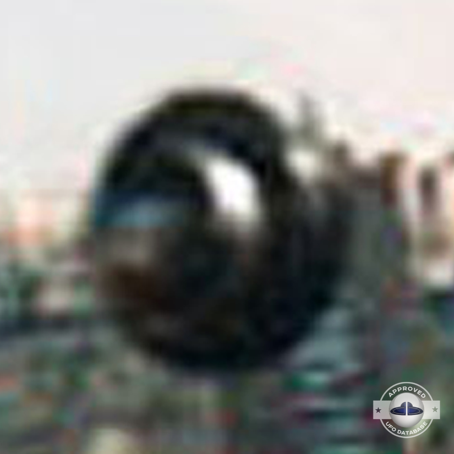 In bright day light over a water canal in the middle of Madrid UFO Picture #42-5