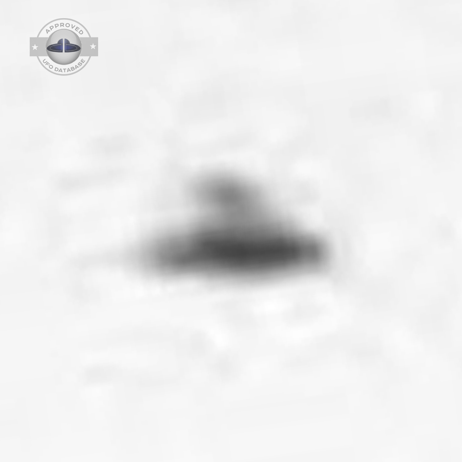 Black and white UFO picture showing UFO flying over busy street UFO Picture #43-5