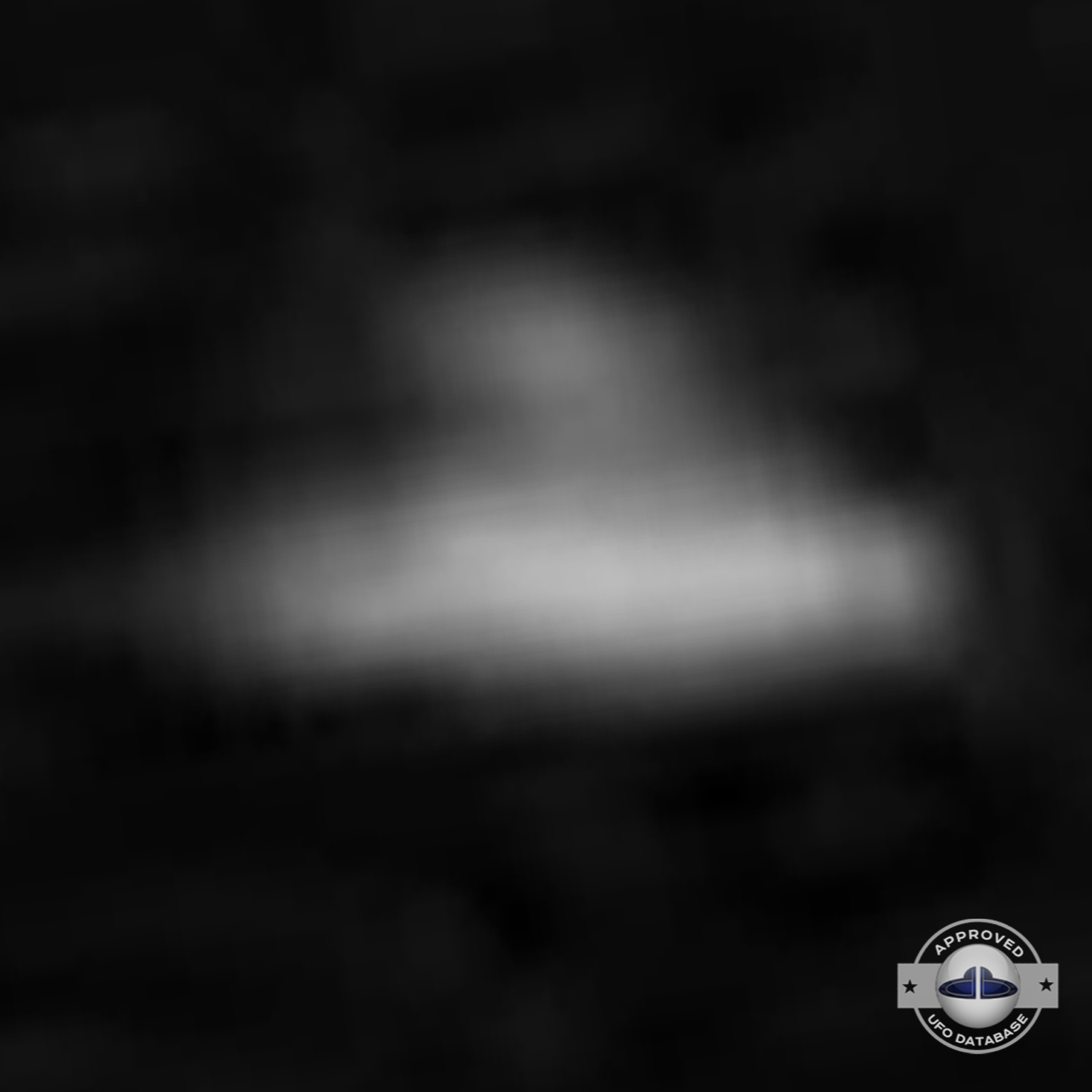 Black and white UFO picture showing UFO flying over busy street UFO Picture #43-7