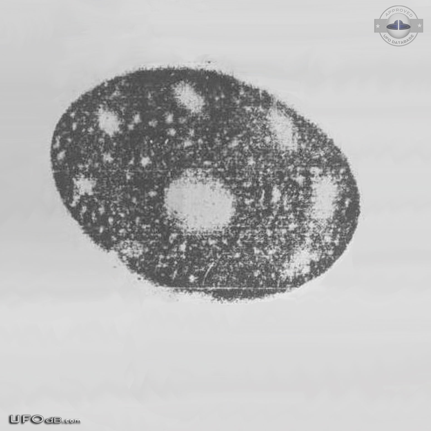 UFO picture taken in Malaysia in 1979 shows round propulsion under it UFO Picture #450-2
