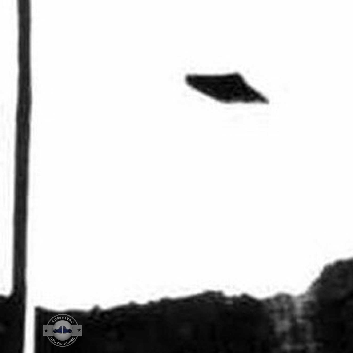 UFO seen over mountain and forest with seem to be snow on the ground UFO Picture #75-3