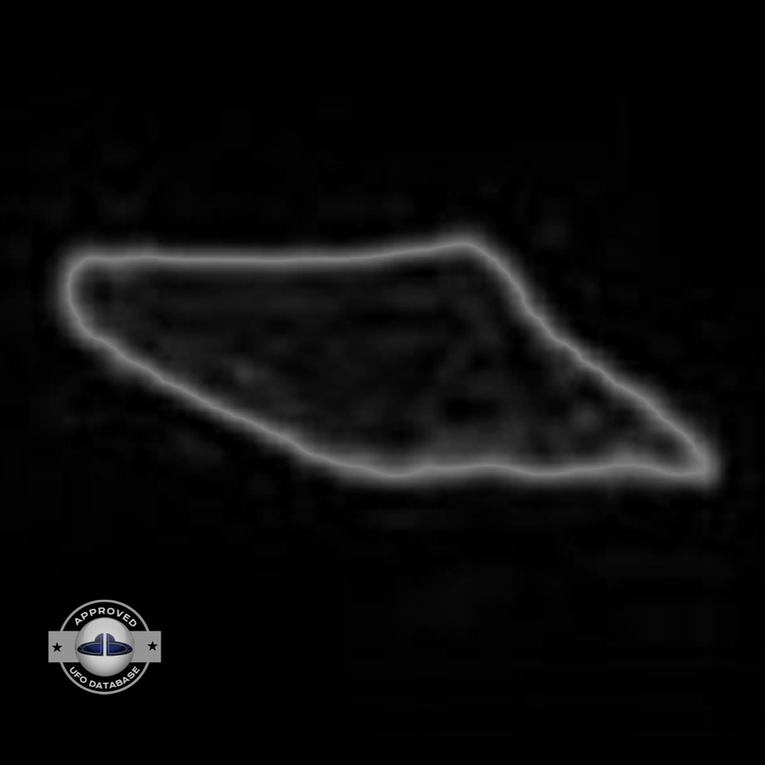 UFO seen over mountain and forest with seem to be snow on the ground UFO Picture #75-6