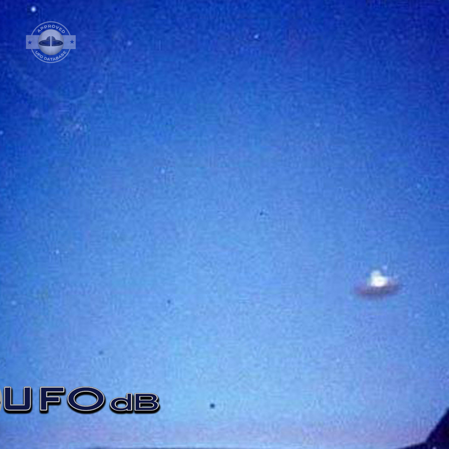 Silver metallic saucer passing over a house in the city of Alkmaar UFO Picture #73-2