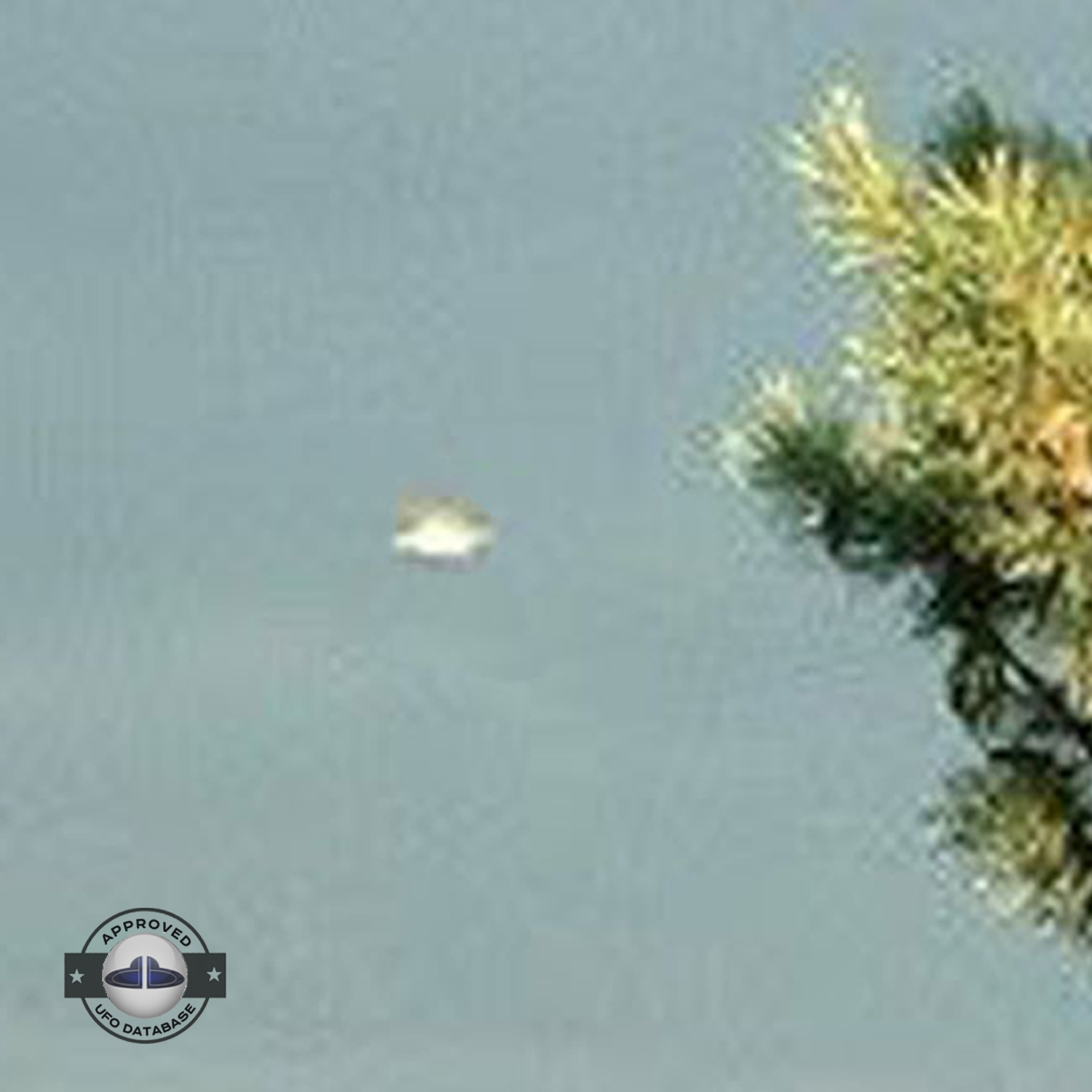 UFO picture - UFO passing in a sunset sky over houses | Watford, UK UFO Picture #142-5