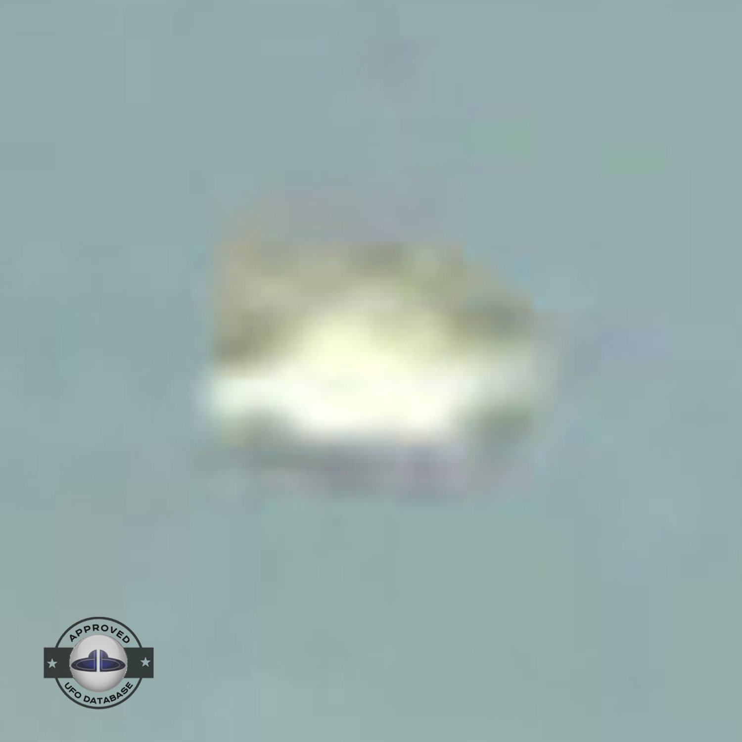 UFO picture - UFO passing in a sunset sky over houses | Watford, UK UFO Picture #142-8