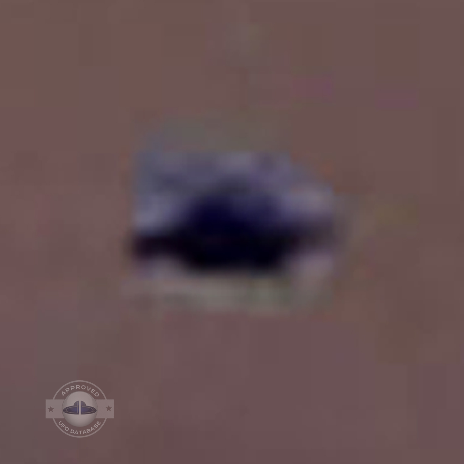UFO picture - UFO passing in a sunset sky over houses | Watford, UK UFO Picture #142-9