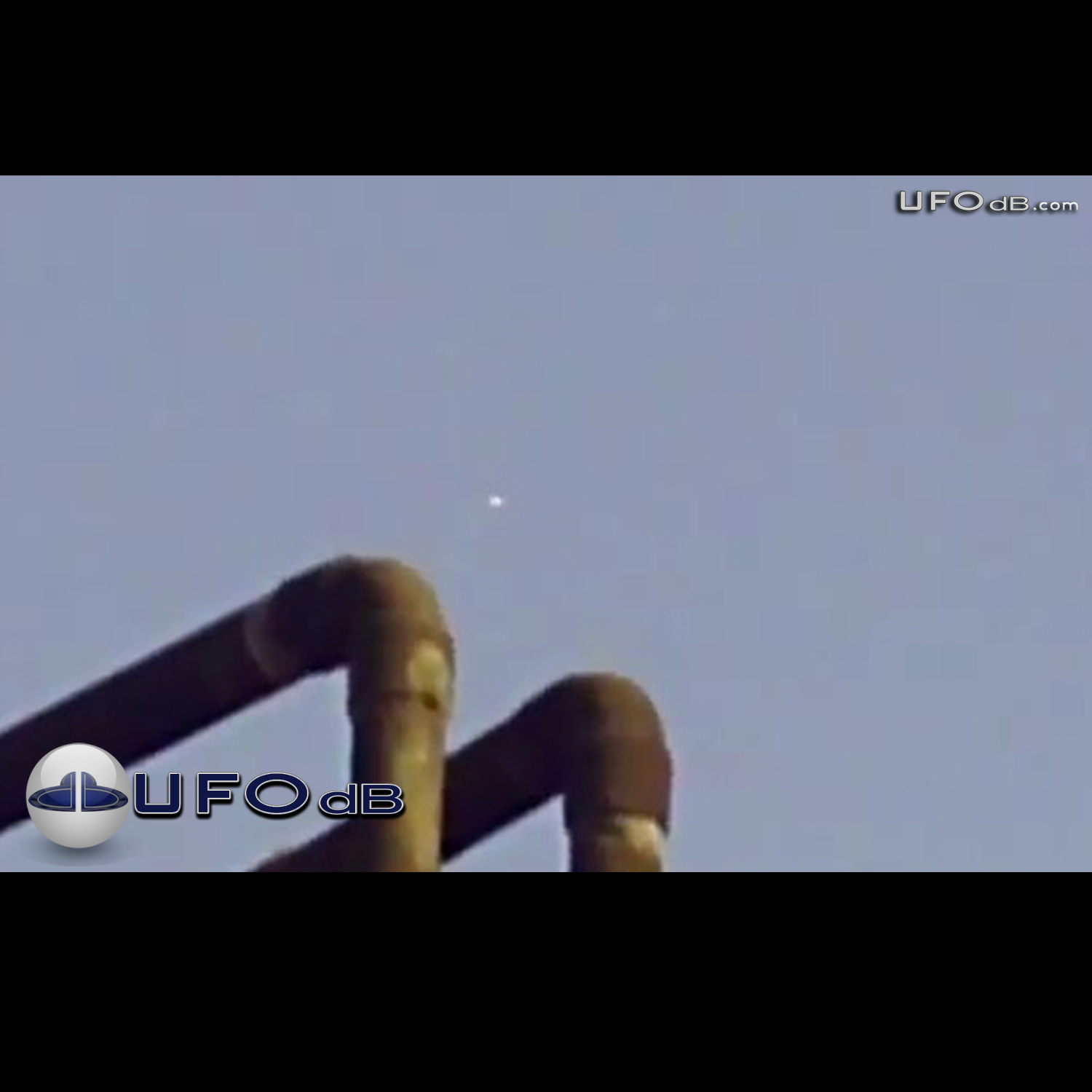 White craft UFO passing in the clouds of Mexico City | May 13 2011 UFO Picture #305-1