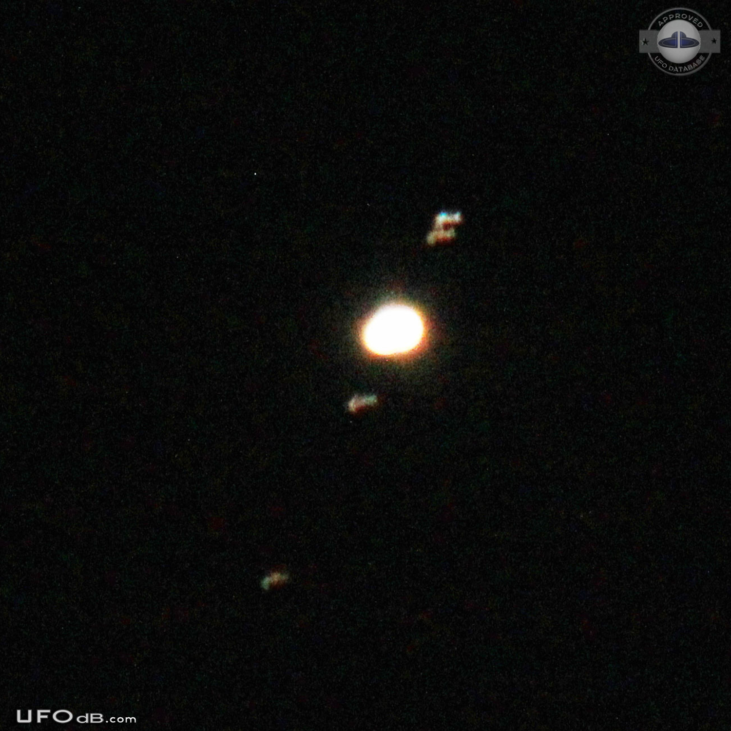 circle with white dots that may be lights but not on. Moved w/o sound UFO Picture #578-1