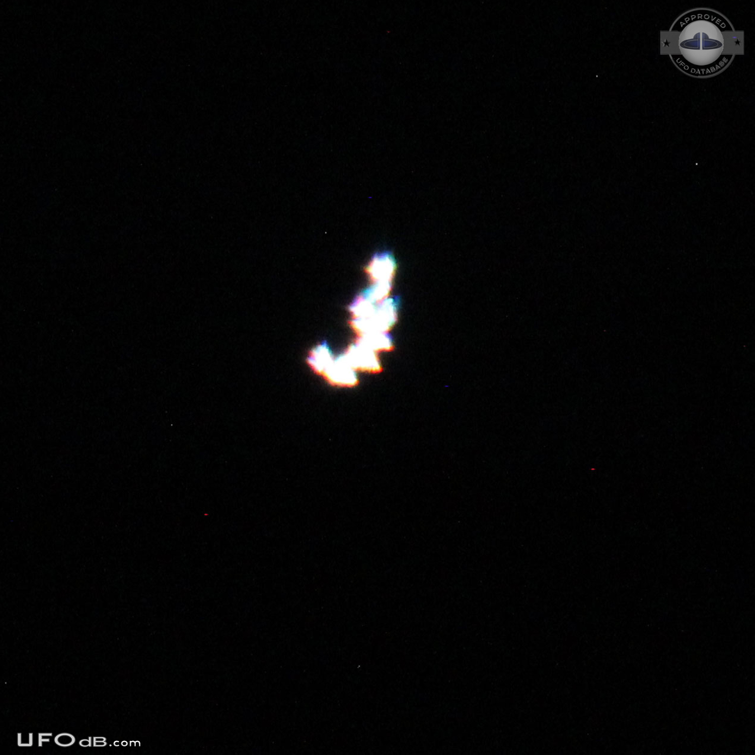 circle with white dots that may be lights but not on. Moved w/o sound UFO Picture #578-2
