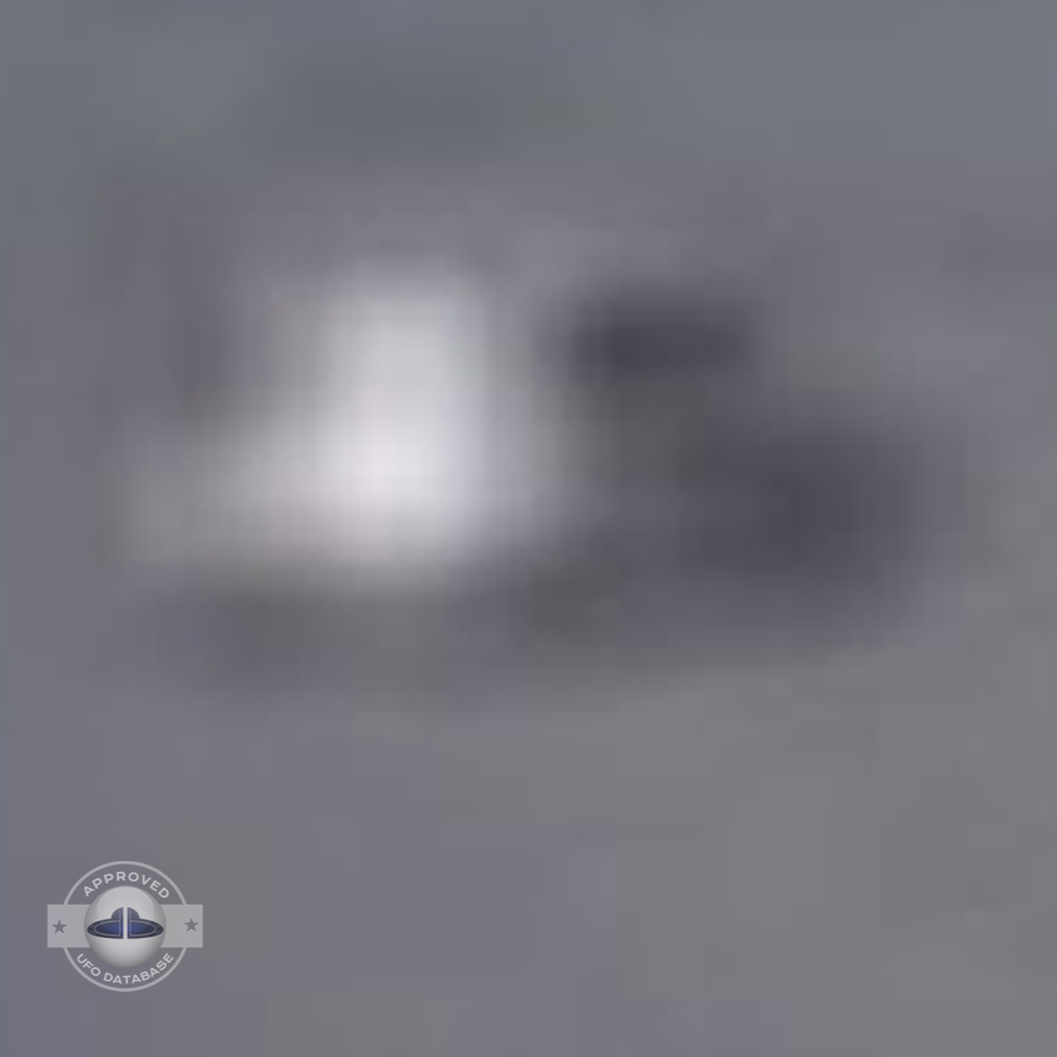 UFO over the country in Scotland during the day in a blue sky UFO Picture #15-5