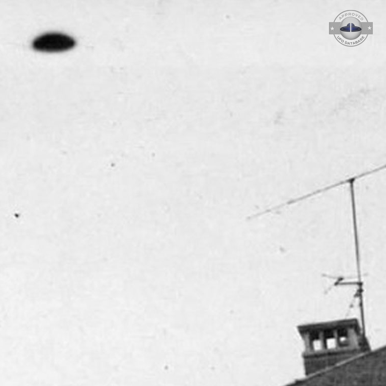UFO Picture showing UFO beside city house with antenna Nancy Lorraine UFO Picture #64-3