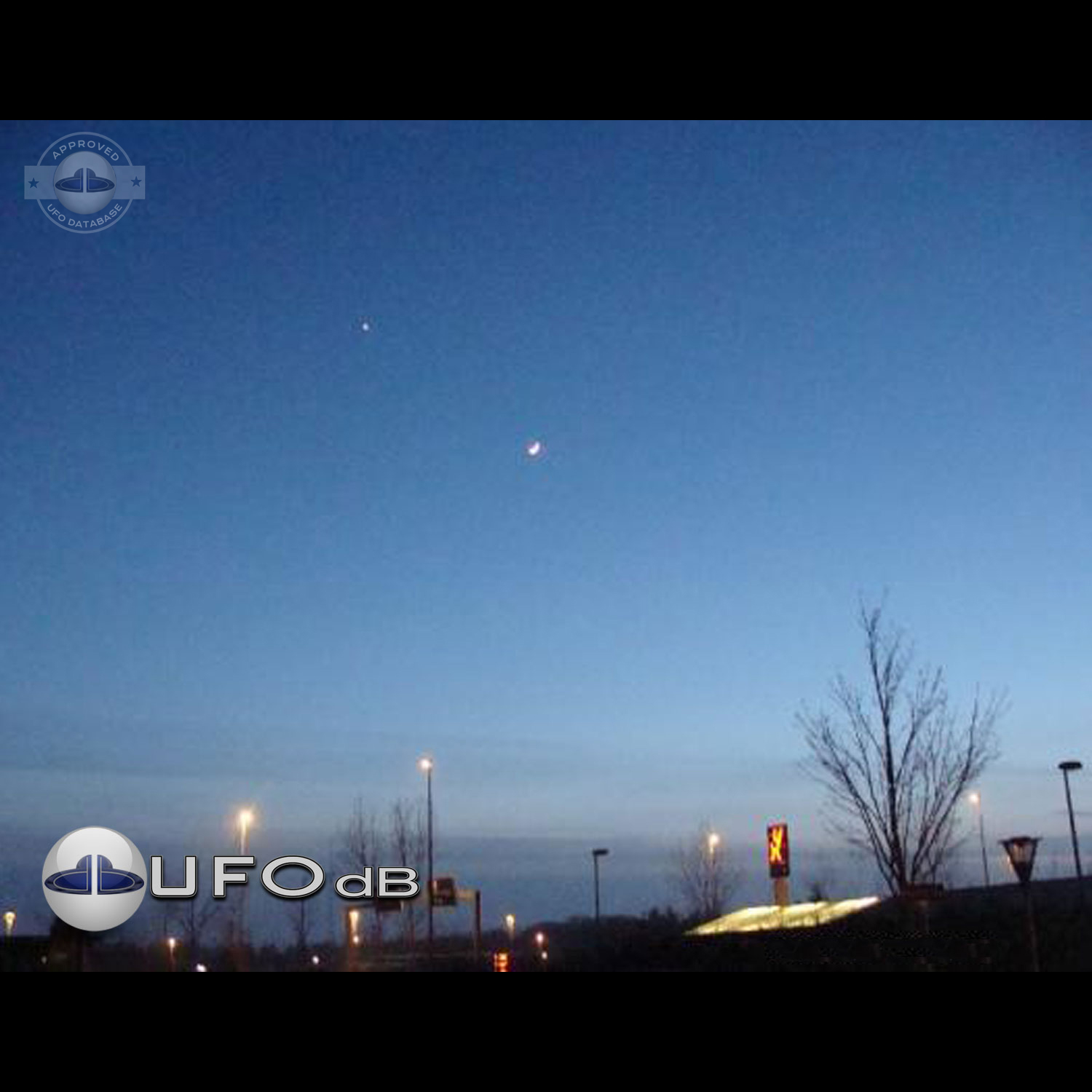 UFO picture of a UFO over a city at night fall in Denmark UFO Picture #10-1