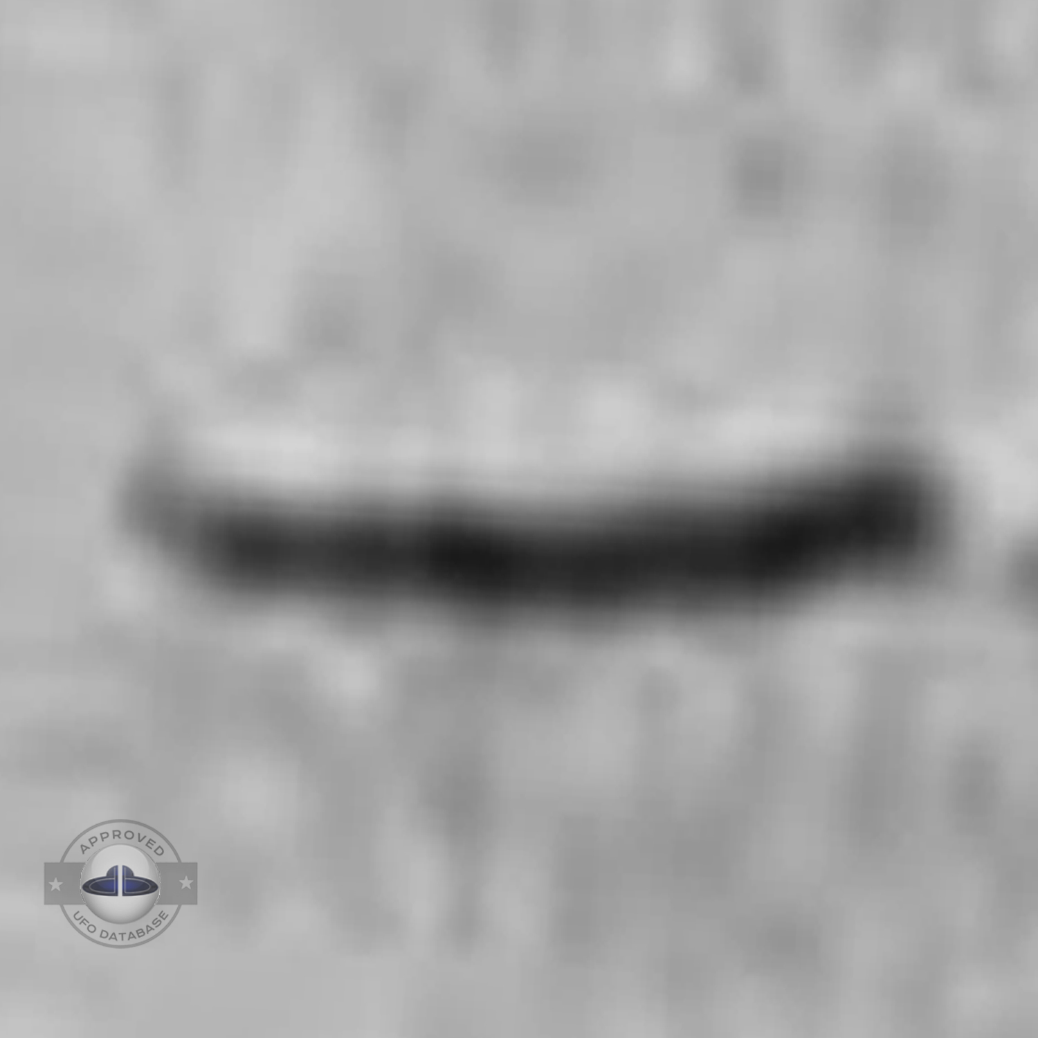 UFO picture, Cigar shaped UFO flying horizontally and low in the sky UFO Picture #120-6