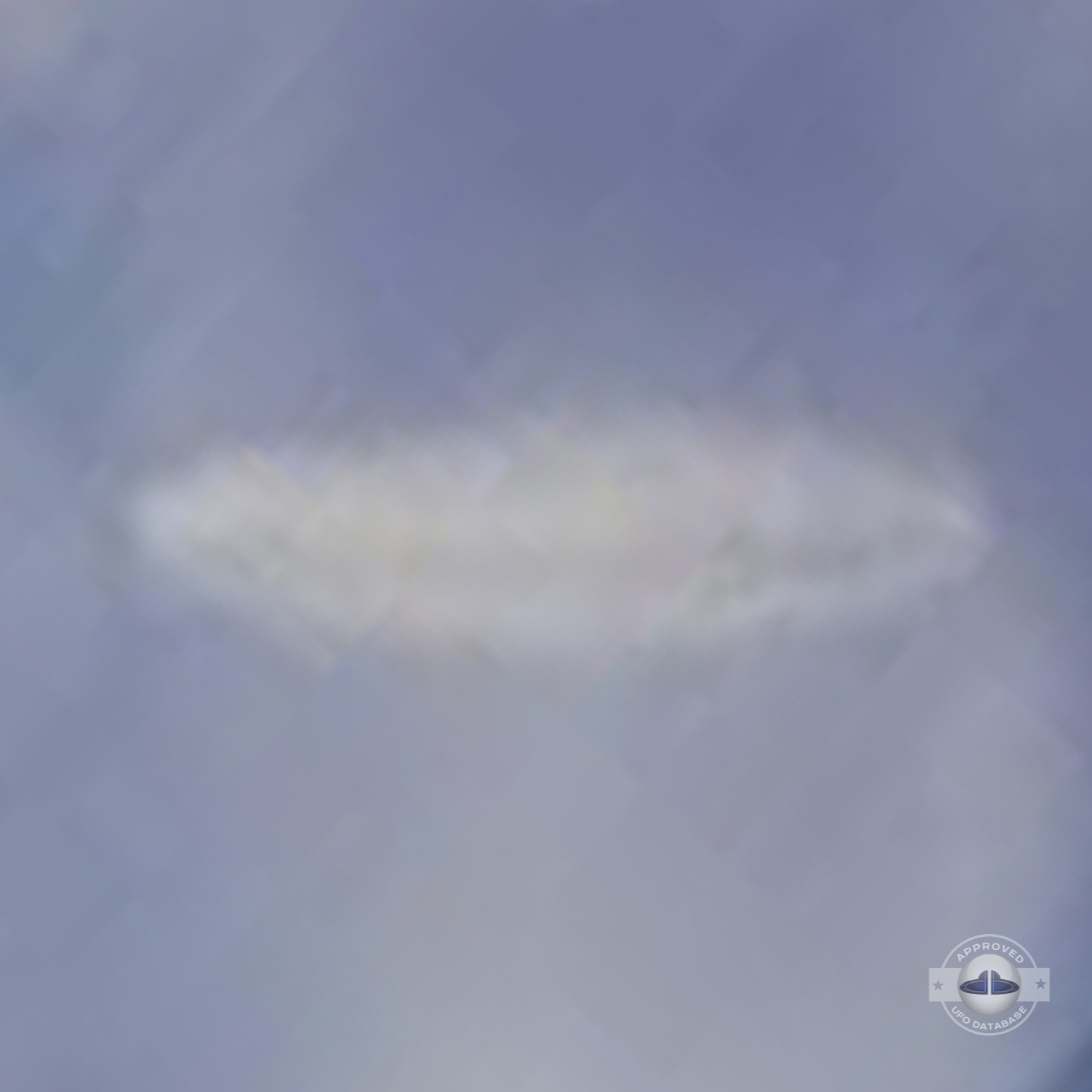 UFO almost sideways over buildings leaving a white gaseous trail 1957 UFO Picture #124-5