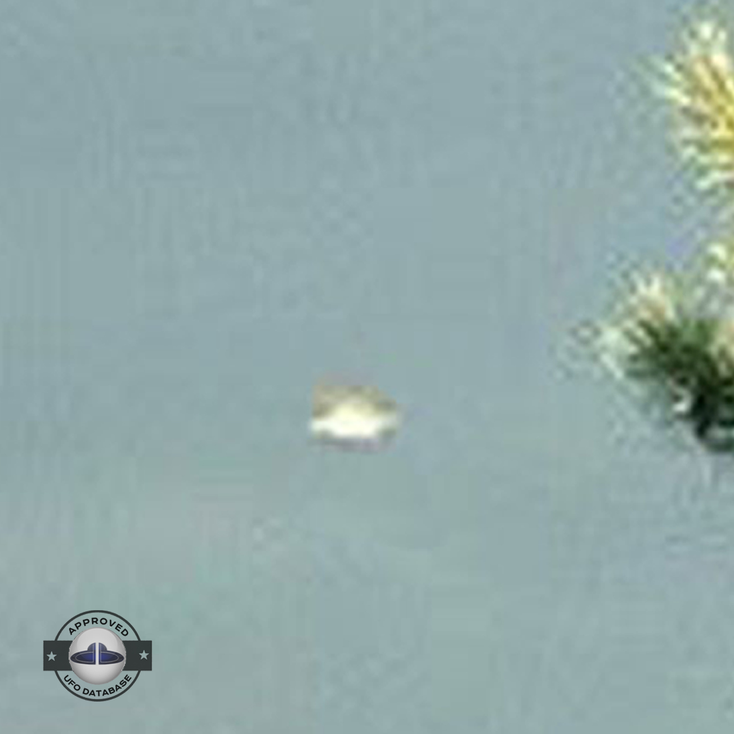 UFO picture - UFO passing in a sunset sky over houses | Watford, UK UFO Picture #142-6