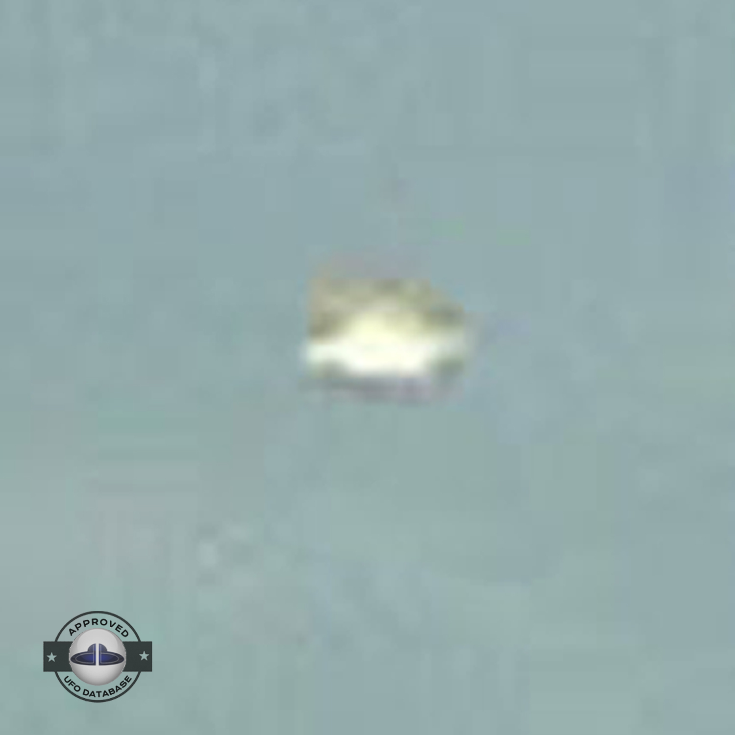 UFO picture - UFO passing in a sunset sky over houses | Watford, UK UFO Picture #142-7