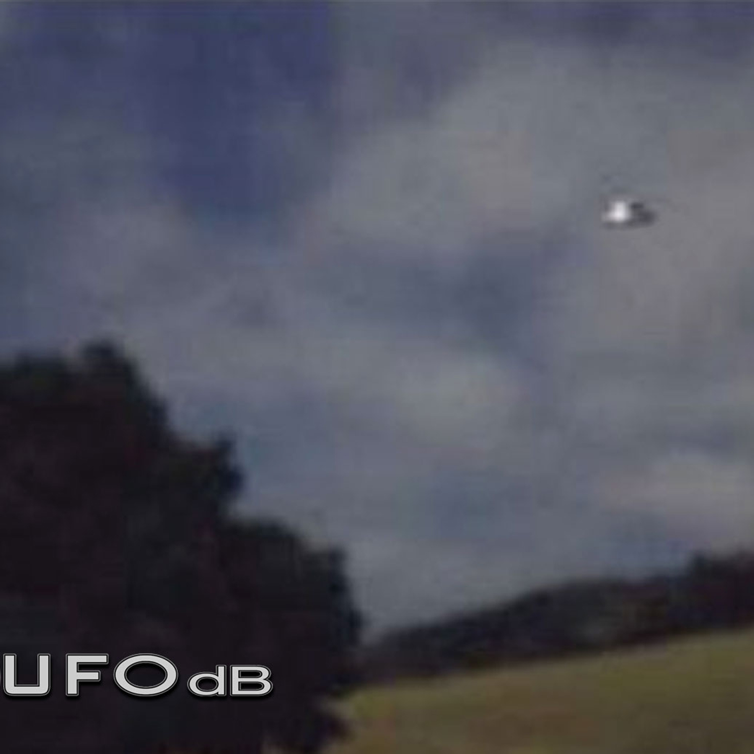 UFO over the country in Scotland during the day in a blue sky UFO Picture #15-2